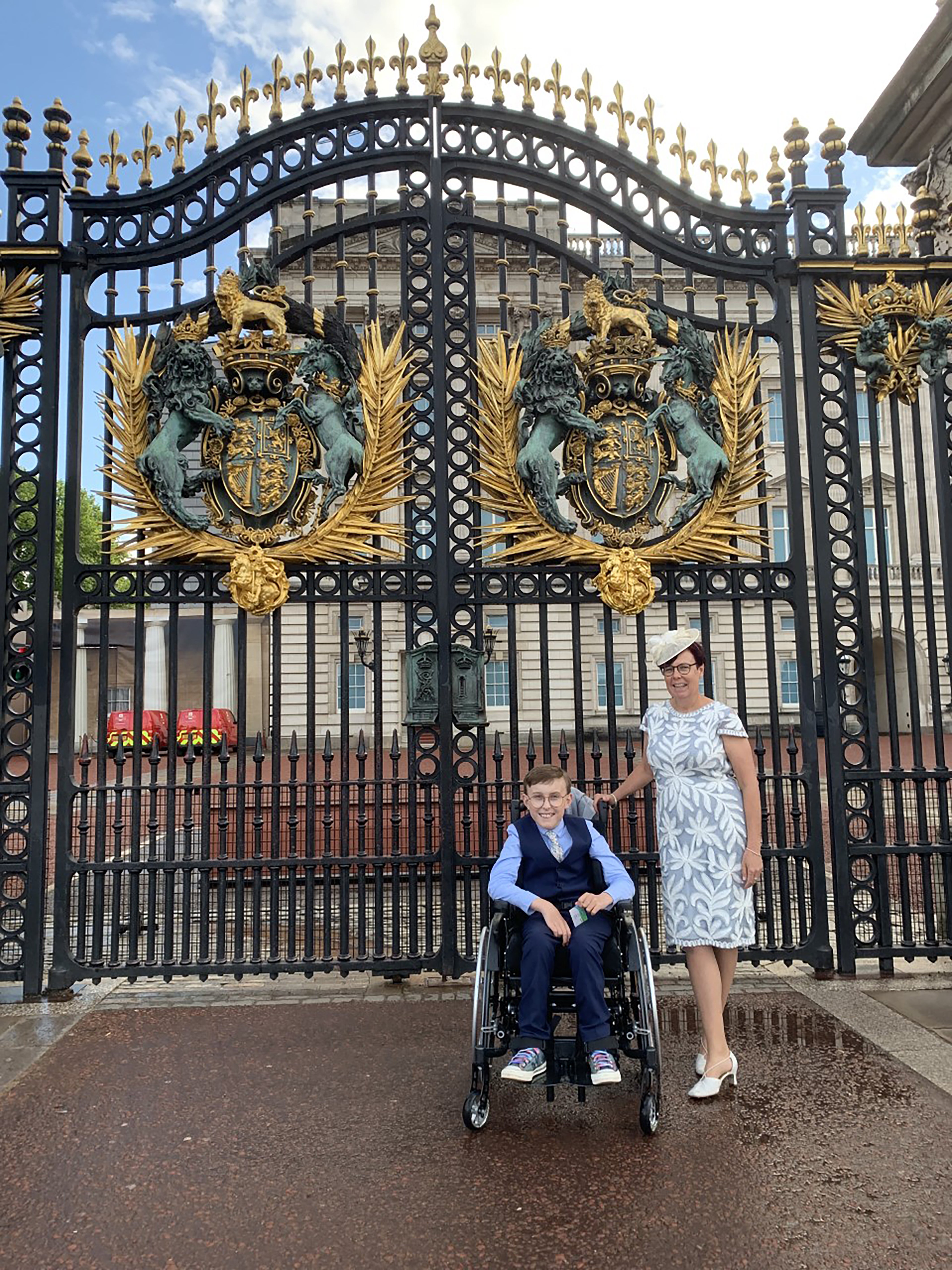 Tobias Weller, 11, with his mother Ruth Garbutt at Buckingham Palace (Family handout/PA)