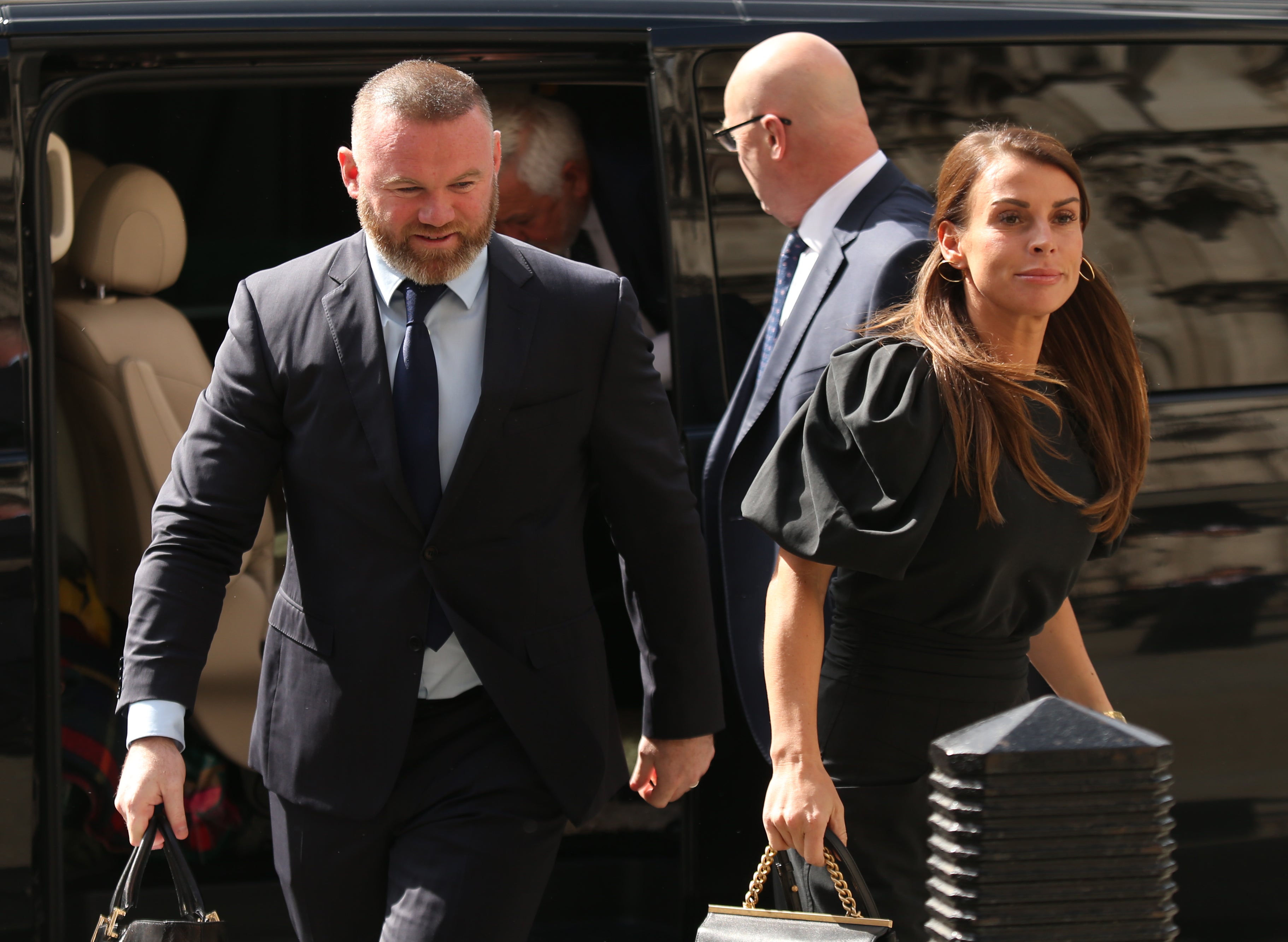 Coleen and Wayne Rooney arrive at the Royal Courts Of Justice