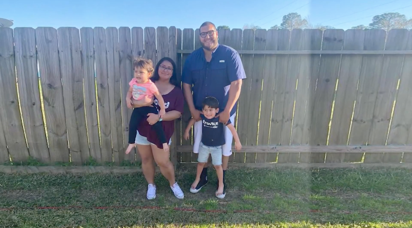 Robert Adam Howard, right, is seen with his wife and 2-year-old daughter and 5-year-old son