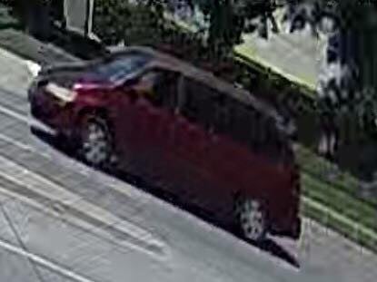 The suspect drove away in a maroon minivan