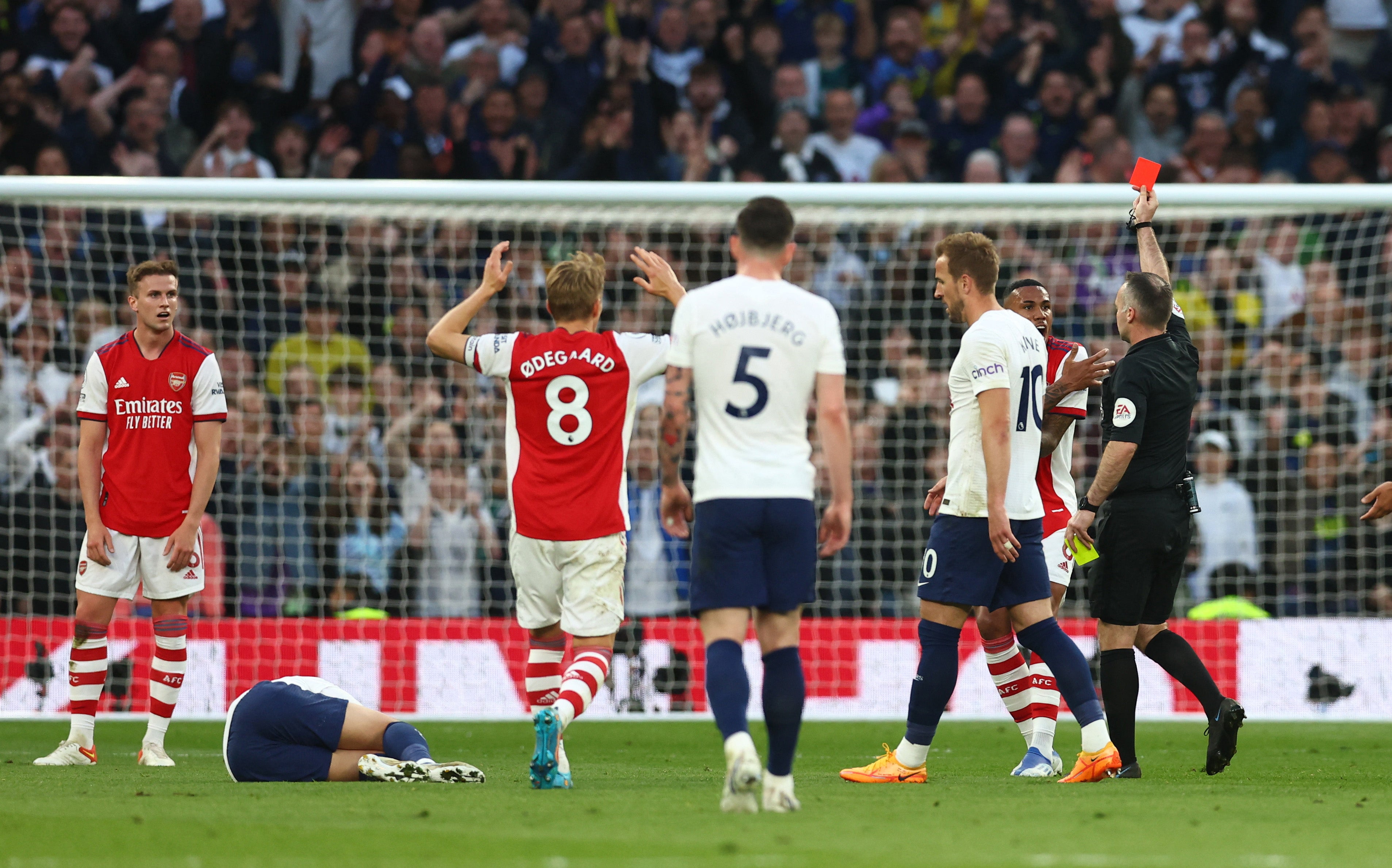 Rob Holding is shown a red card by referee Paul Tierney