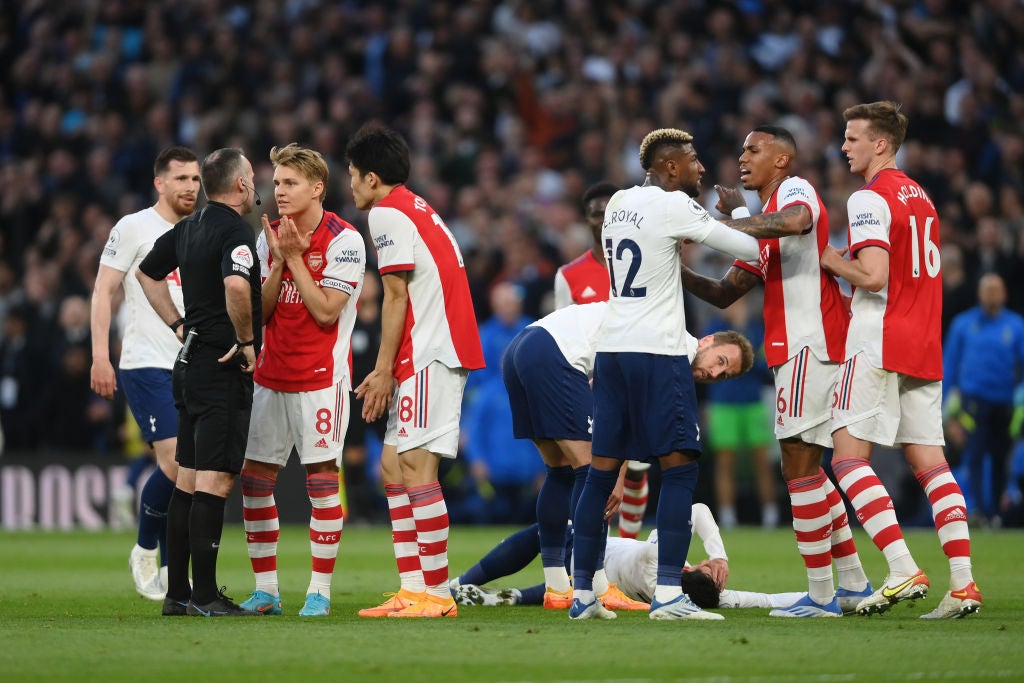 The referee attempts to keep order before Rob Holding (far right) is sent off