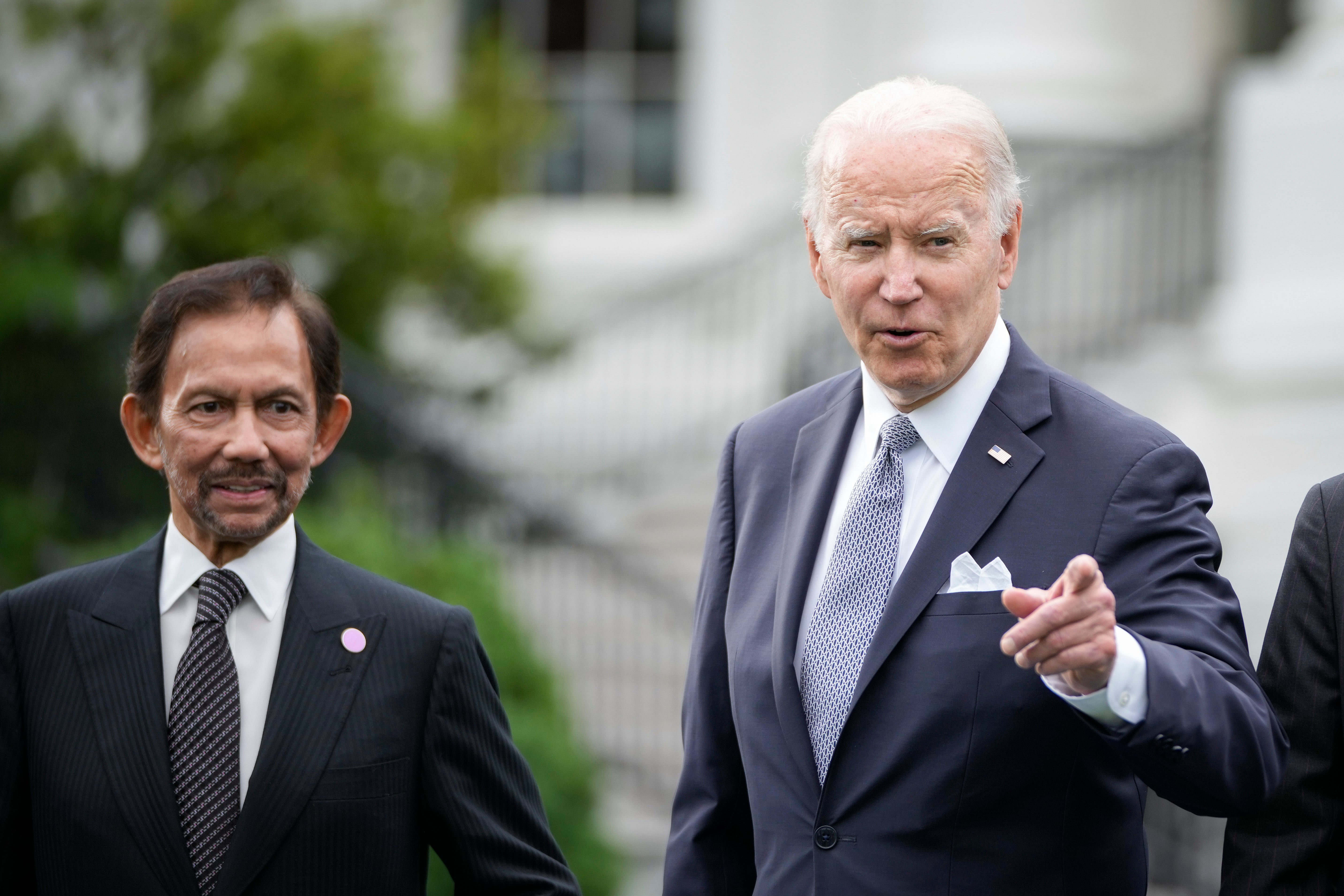 Sultan of Brunei Haji Hassanal Bolkiah looks on as US president Joe Biden reacts to a reporter’s question during a family photo for the US-ASEAN Special Summit on the South Lawn of the White House on 12 May 2022 in Washington, DC