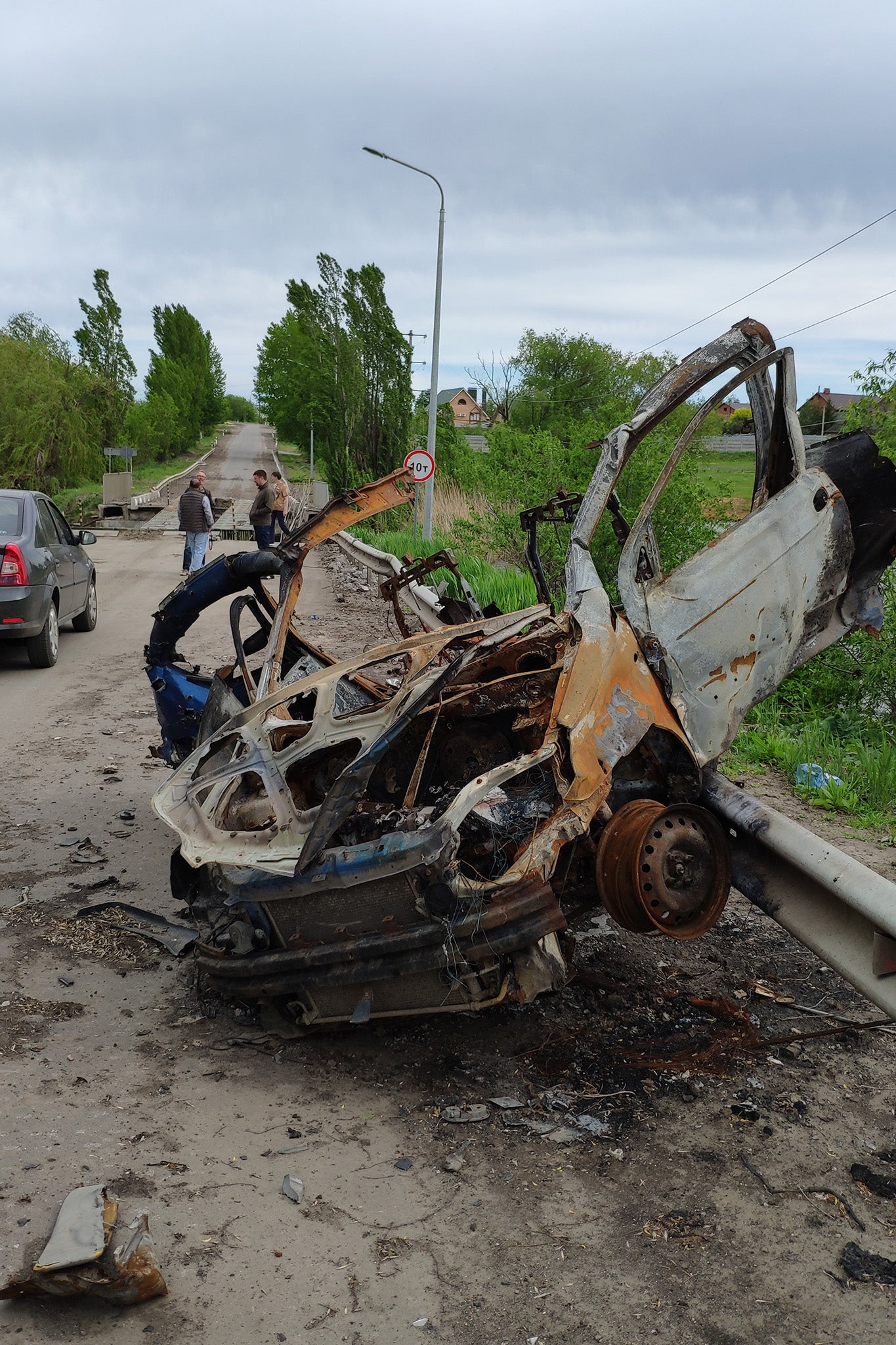 The wreckage of a car destroyed in the fighting