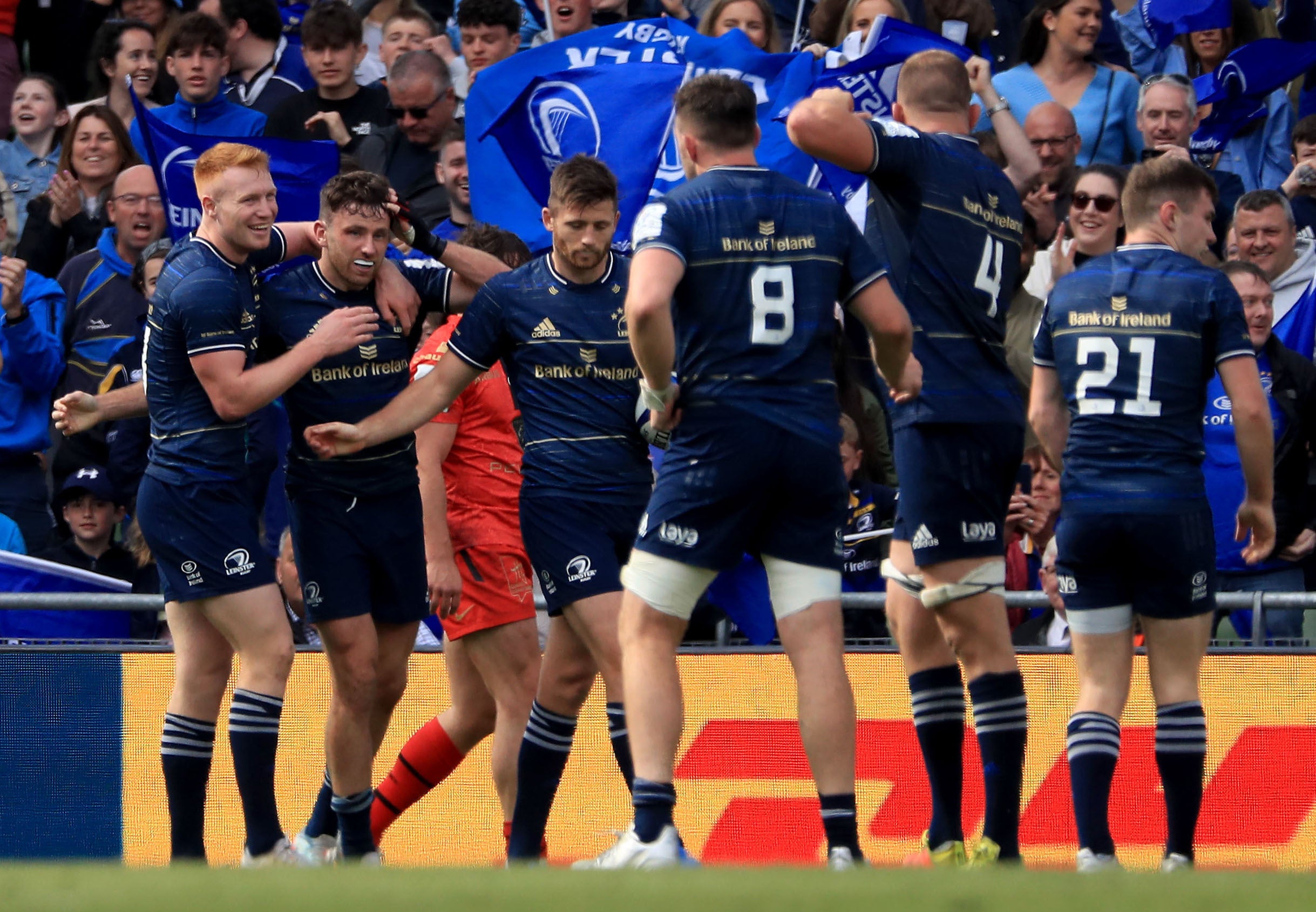 Hugo Keenan (second left) celebrates his late try with teammates