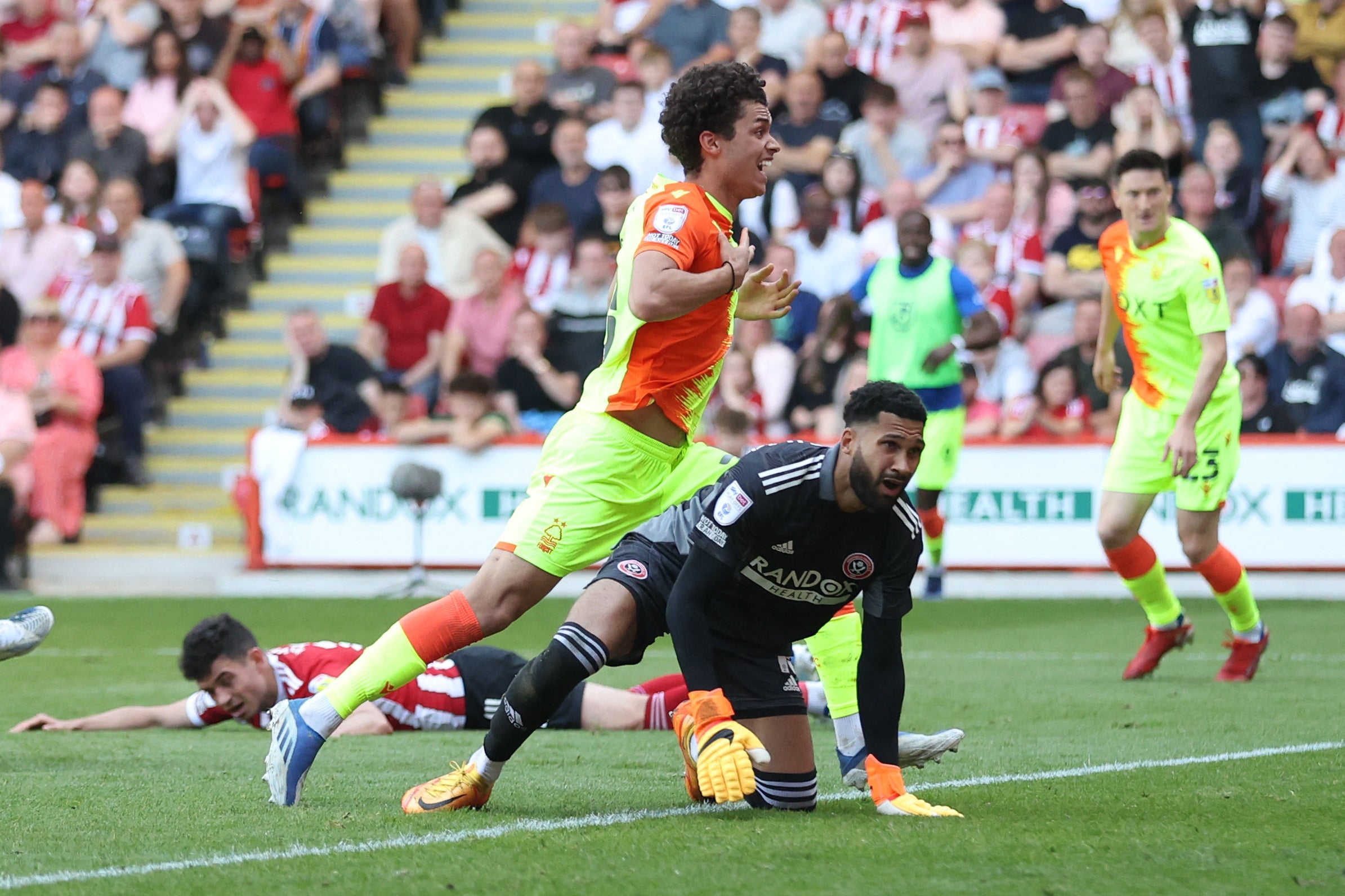 Brennan Johnson celebrates scoring Nottingham Forest’s second goal as Sheffield United goalkeeper Wes Foderingham looks dejected