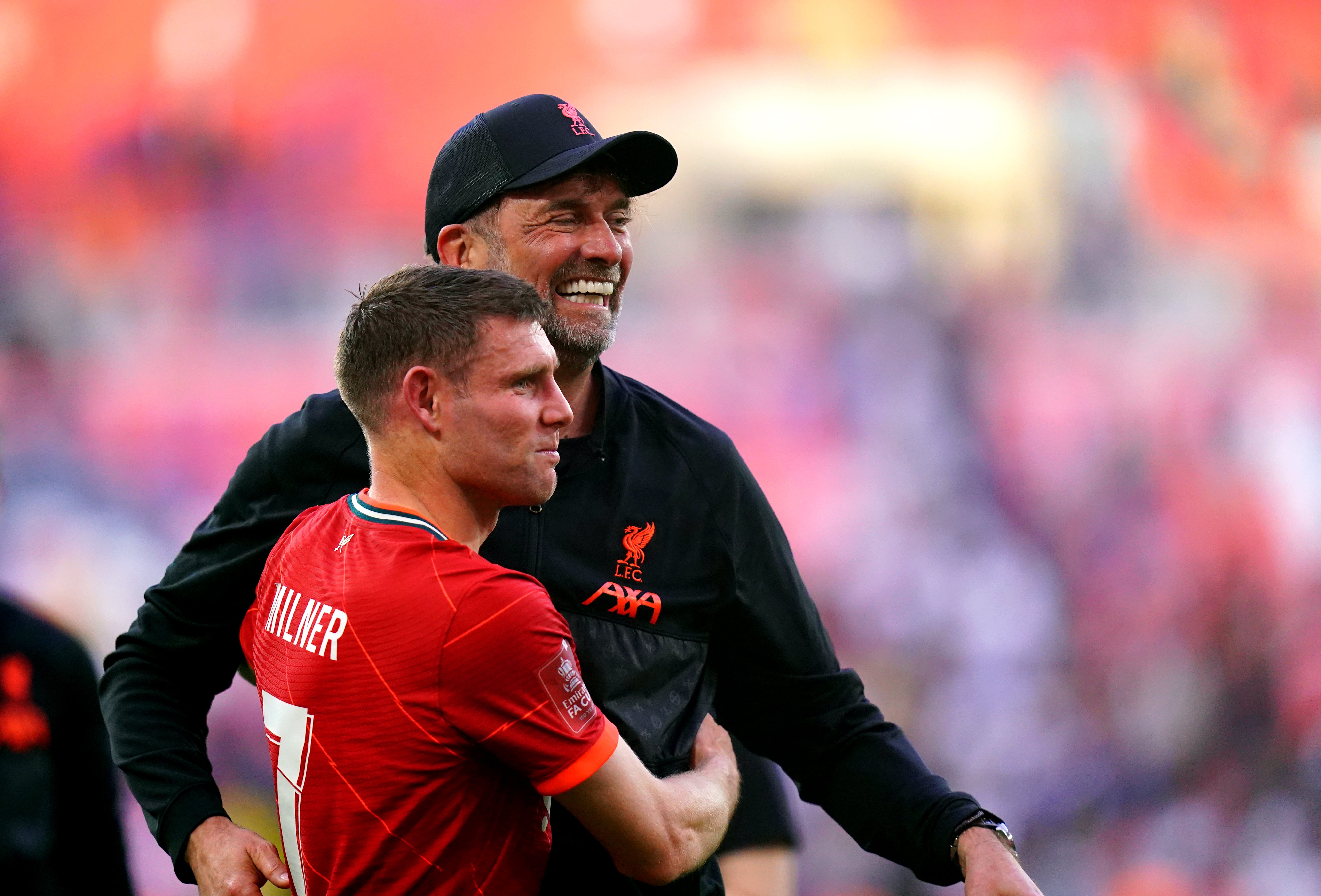 Jurgen Klopp hugs James Milner (Adam Davy/PA)