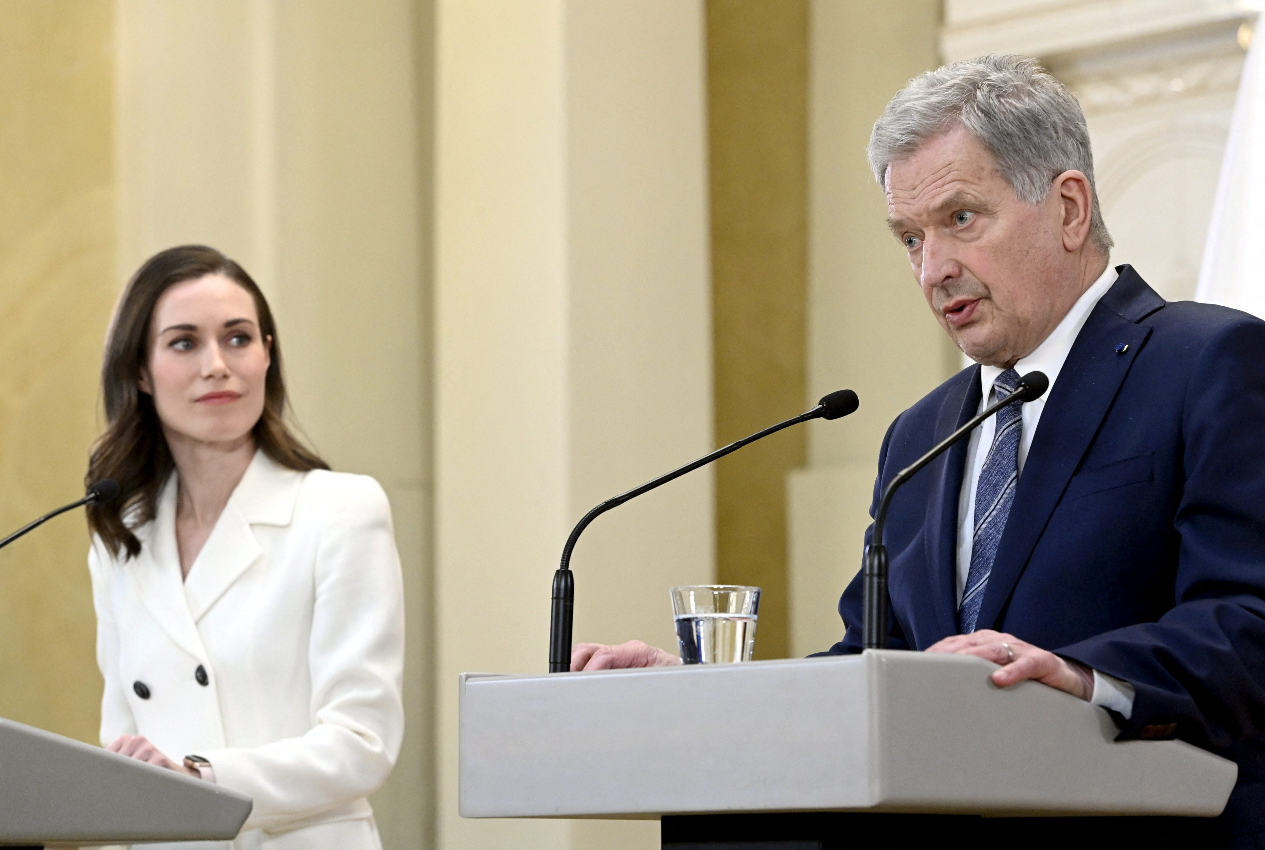 Finland’s prime minister, Sanna Marin (L), and president, Sauli Niinisto, attend a joint news conference on the country’s security policy