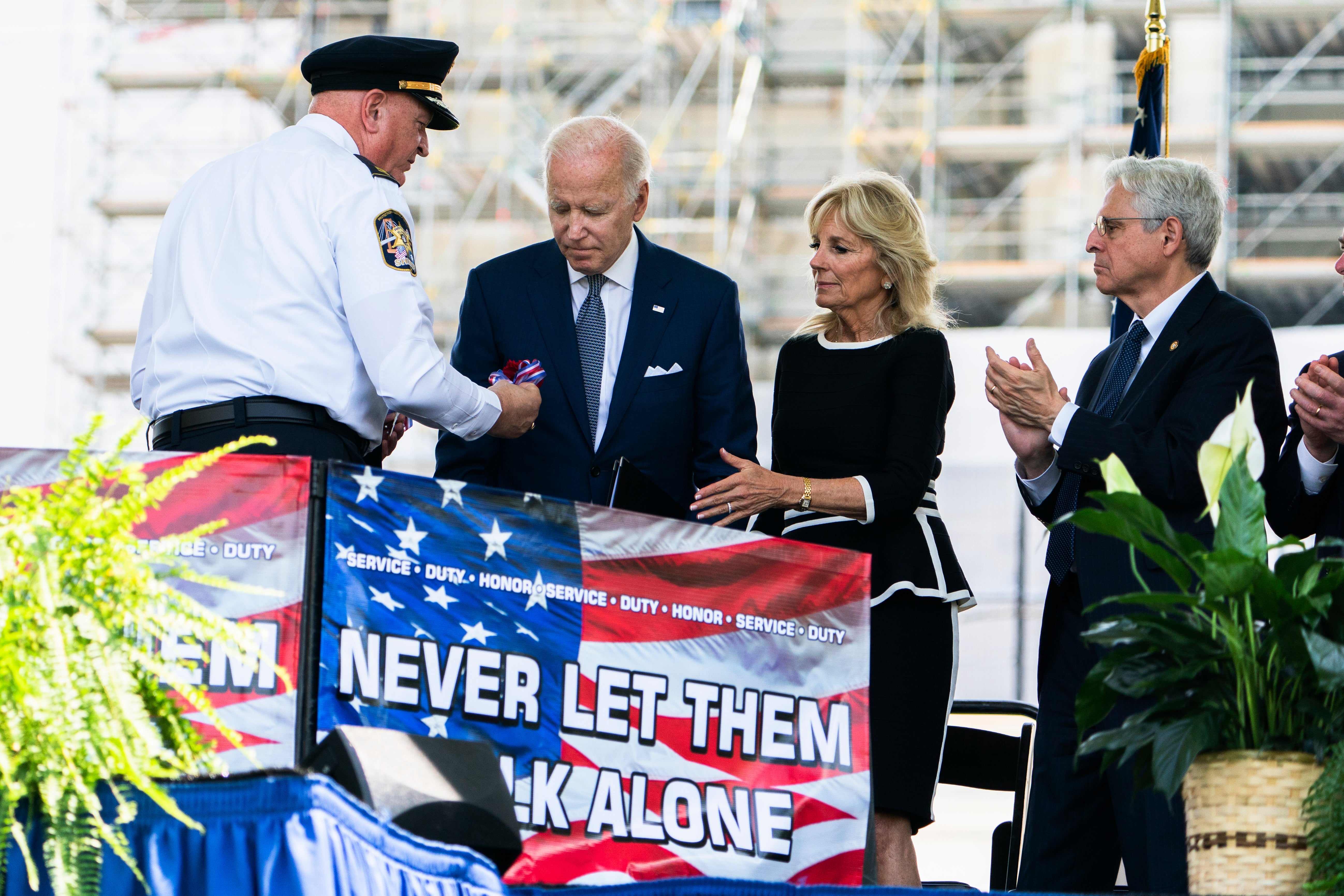 President Biden, First Lady Jill Biden and Attorney General Merrick Garland attend a National Peace Officers Memorial Service in May 2022.