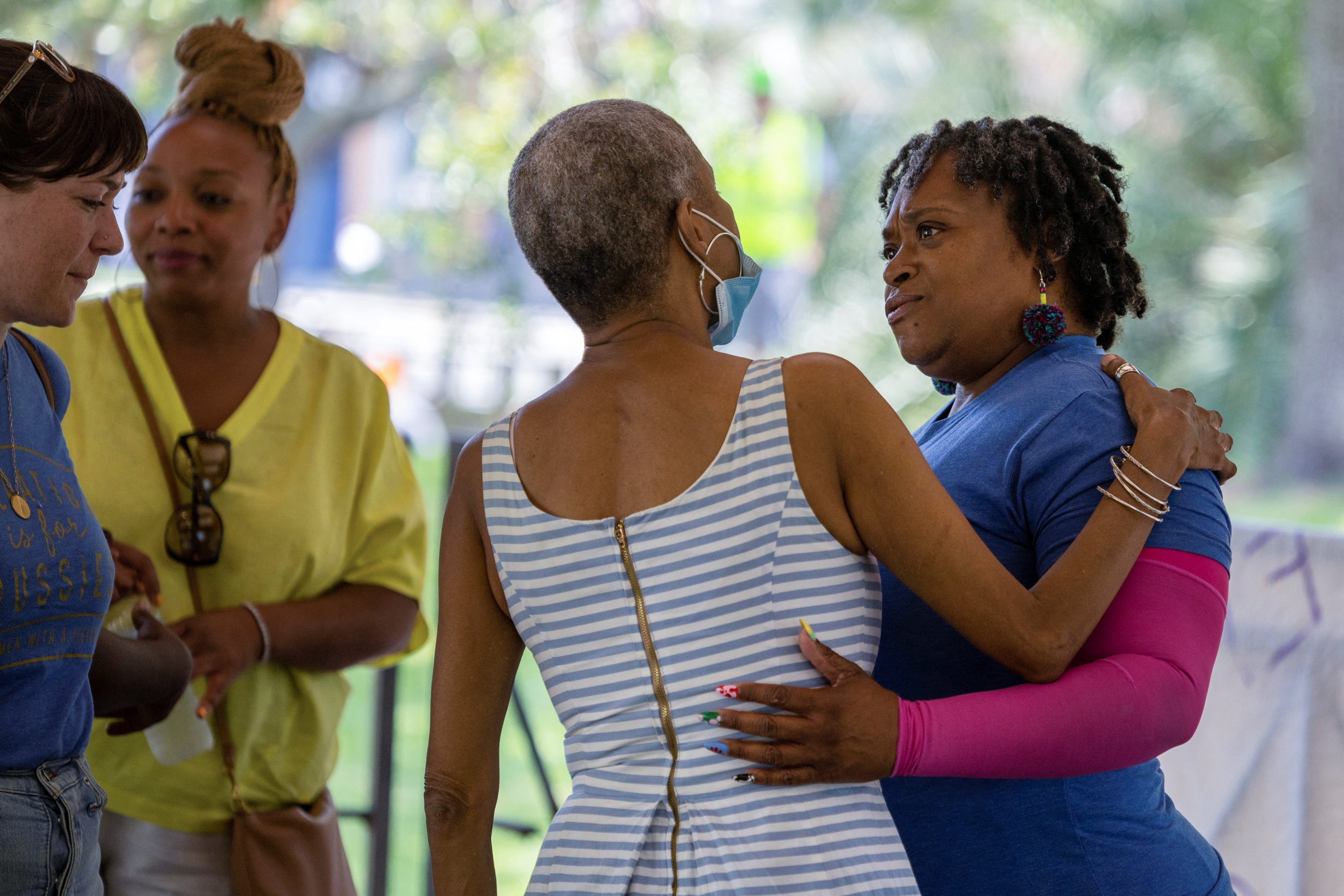 Lift Louisiana statewide outreach coordinator Robin Barber, center, greets Women With a Vision’s Deon Haywood, right, during demonstrations supporting abortion rights in New Orleans on 14 May.