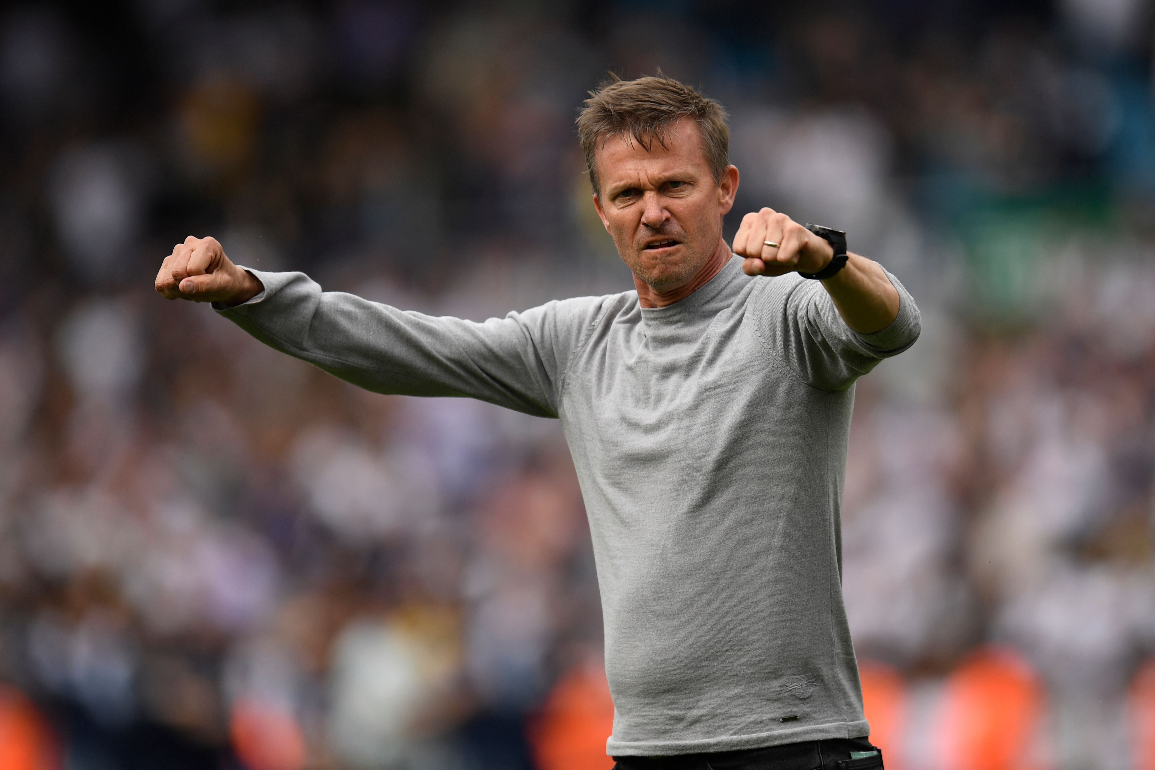 Jesse Marsch gestures to Leeds supporters after salvaging a point against Brighton