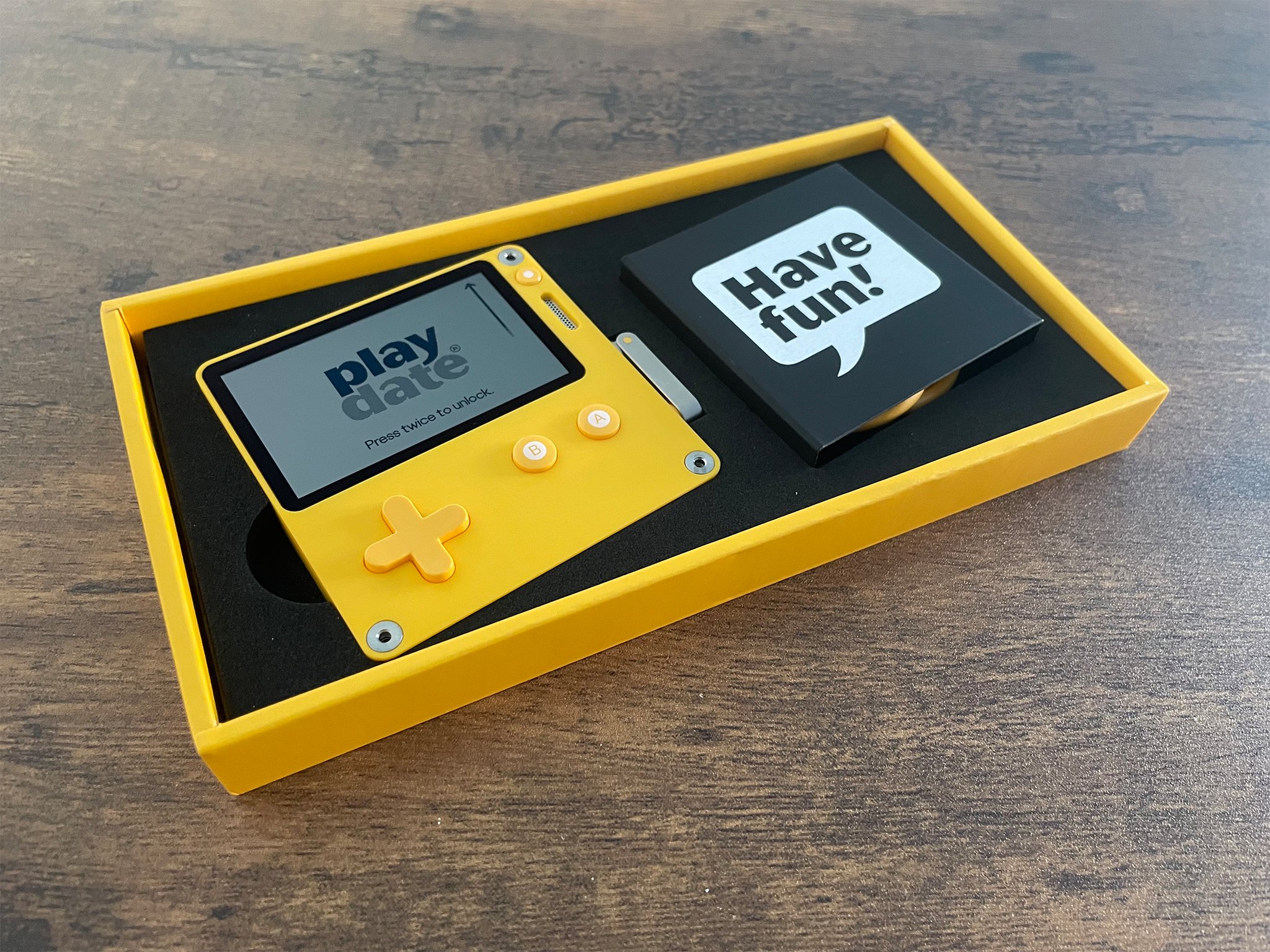 The Playdate comes with a charging cable in a fun little box