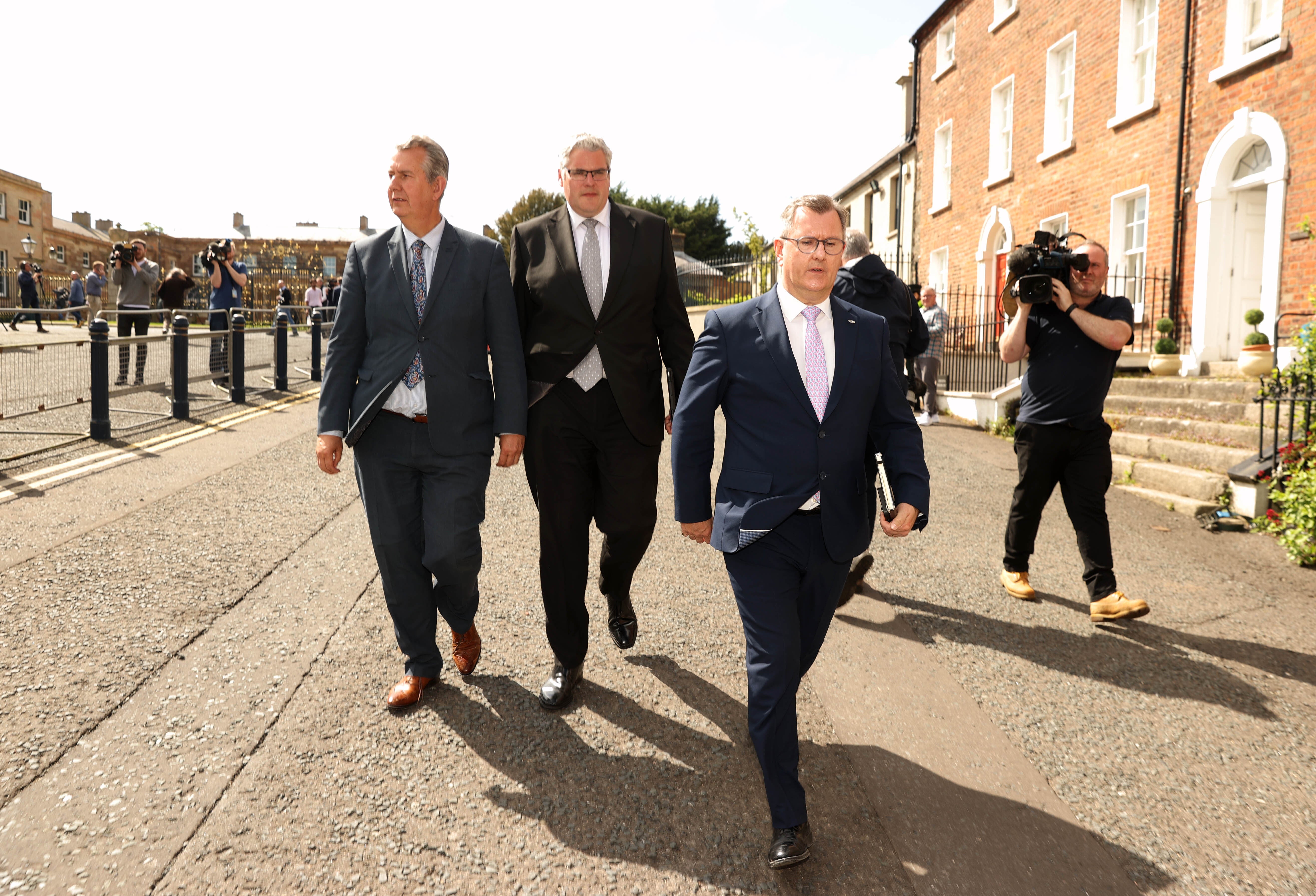 DUP leader Sir Jeffrey Donaldson (right), leaves Hillsborough Castle with colleagues Gavin Robinson MP (centre), and Edwin Poots MLA (left) (Liam McBurney/PA)