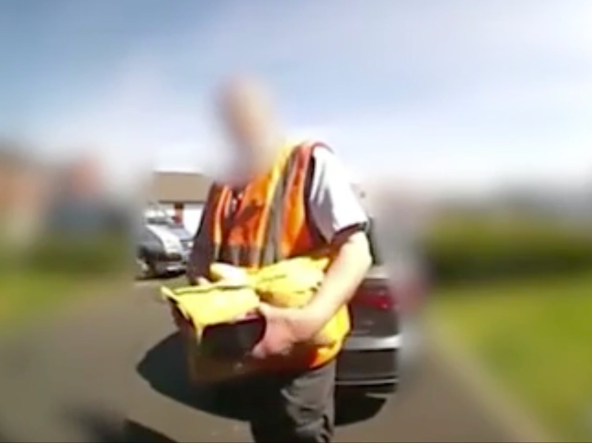 Footage shows the Royal Mail staff member approaching the door of the home in Greater Manchester