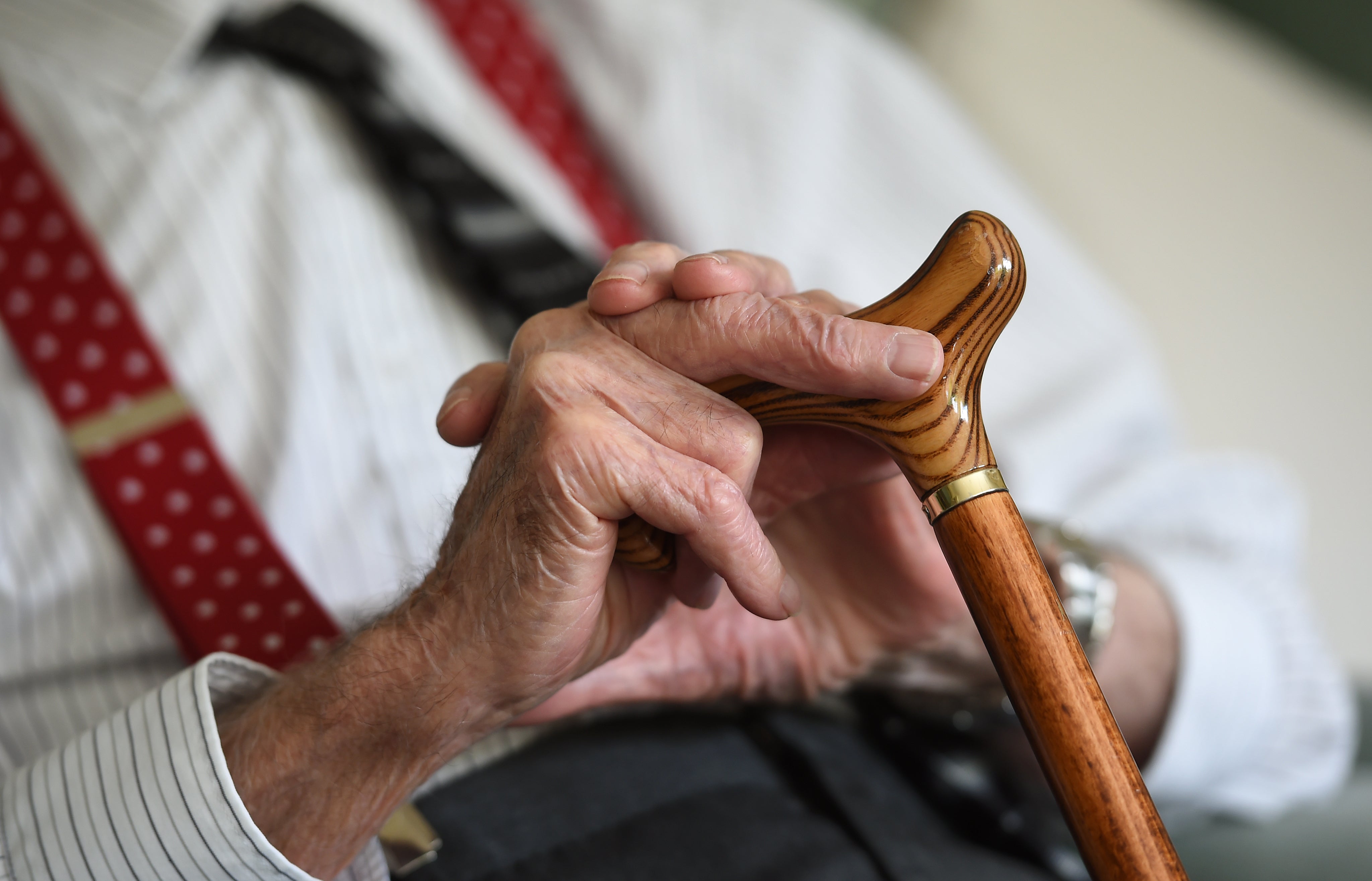 File photo dated 18/05/2017 of an elderly man holding a walking stick. A new study suggests 300,000 people have dementia but are undiagnosed. PA.