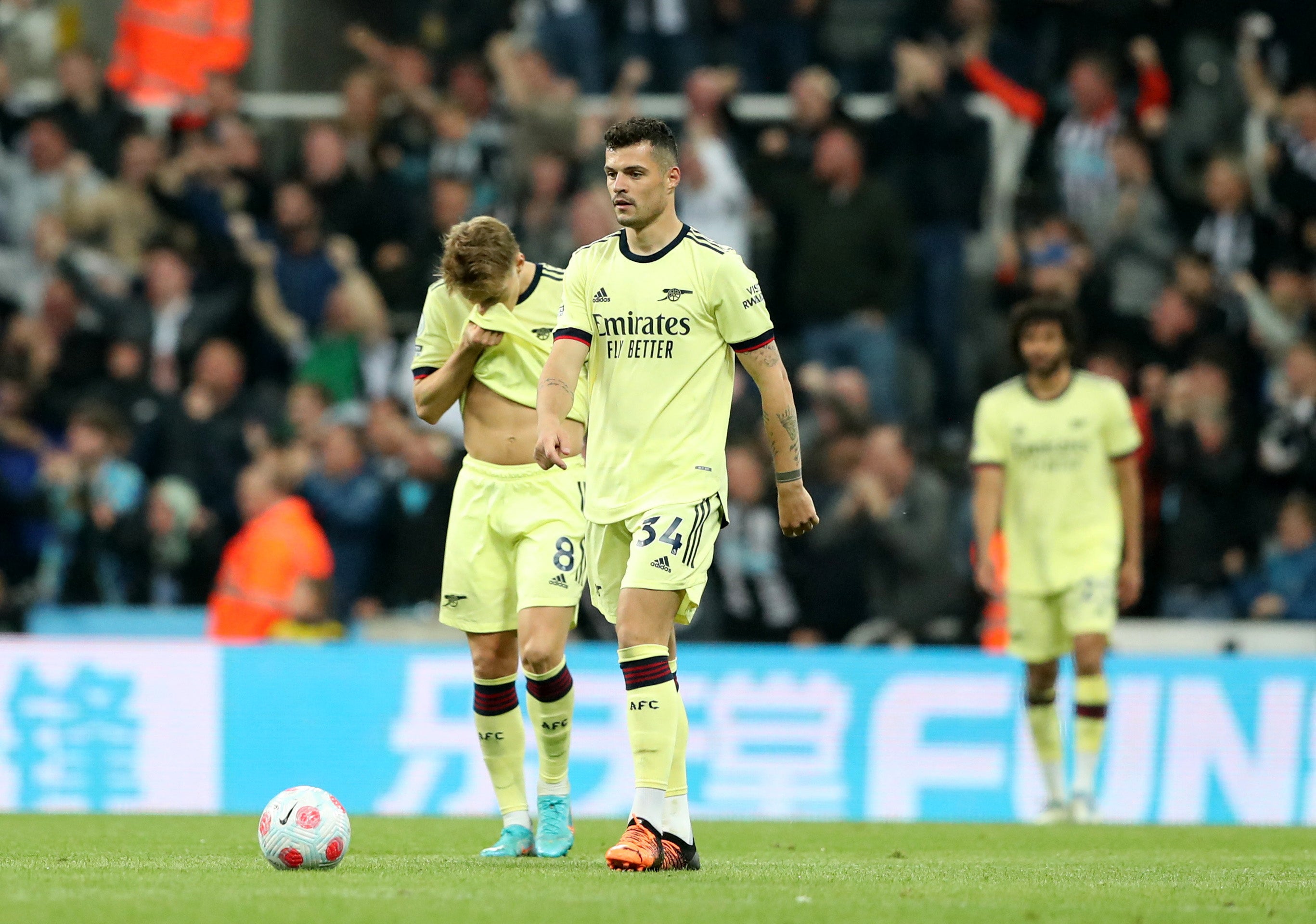 A dejected Granit Xhaka walks away after Gabriel’s own goal