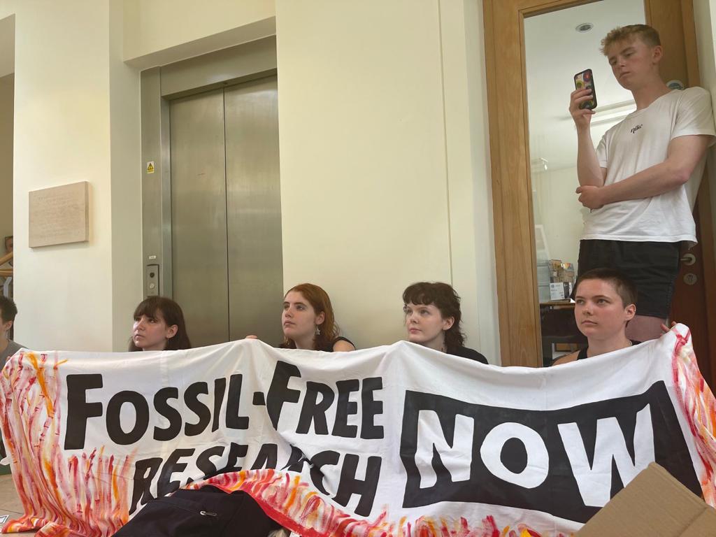 Cambridge University students protest inside the BP Institute in Cambridge.