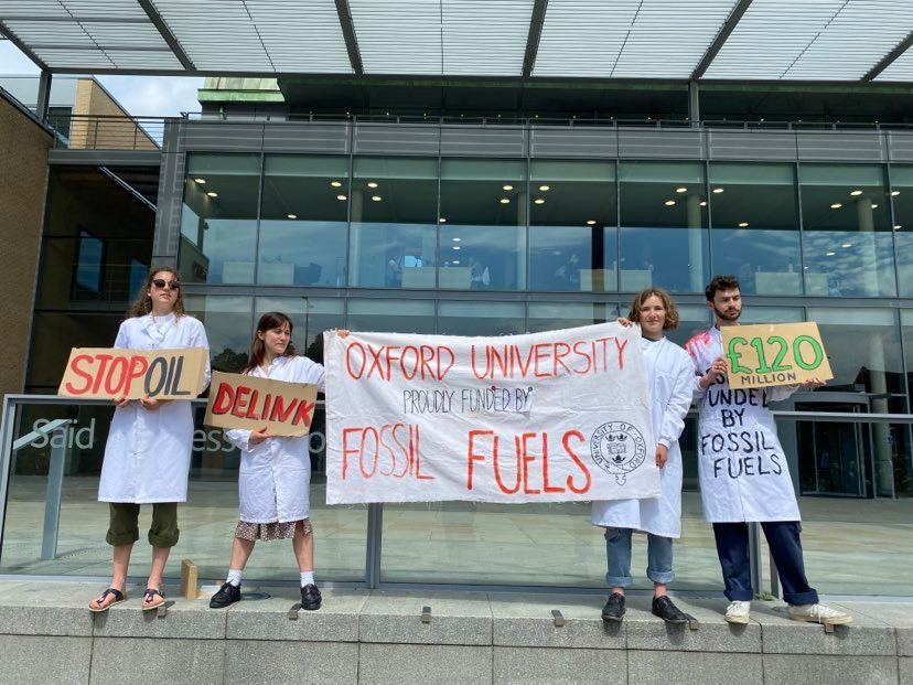 Oxford University students protest outside the Saïd Business school in Oxford on Tuesday.