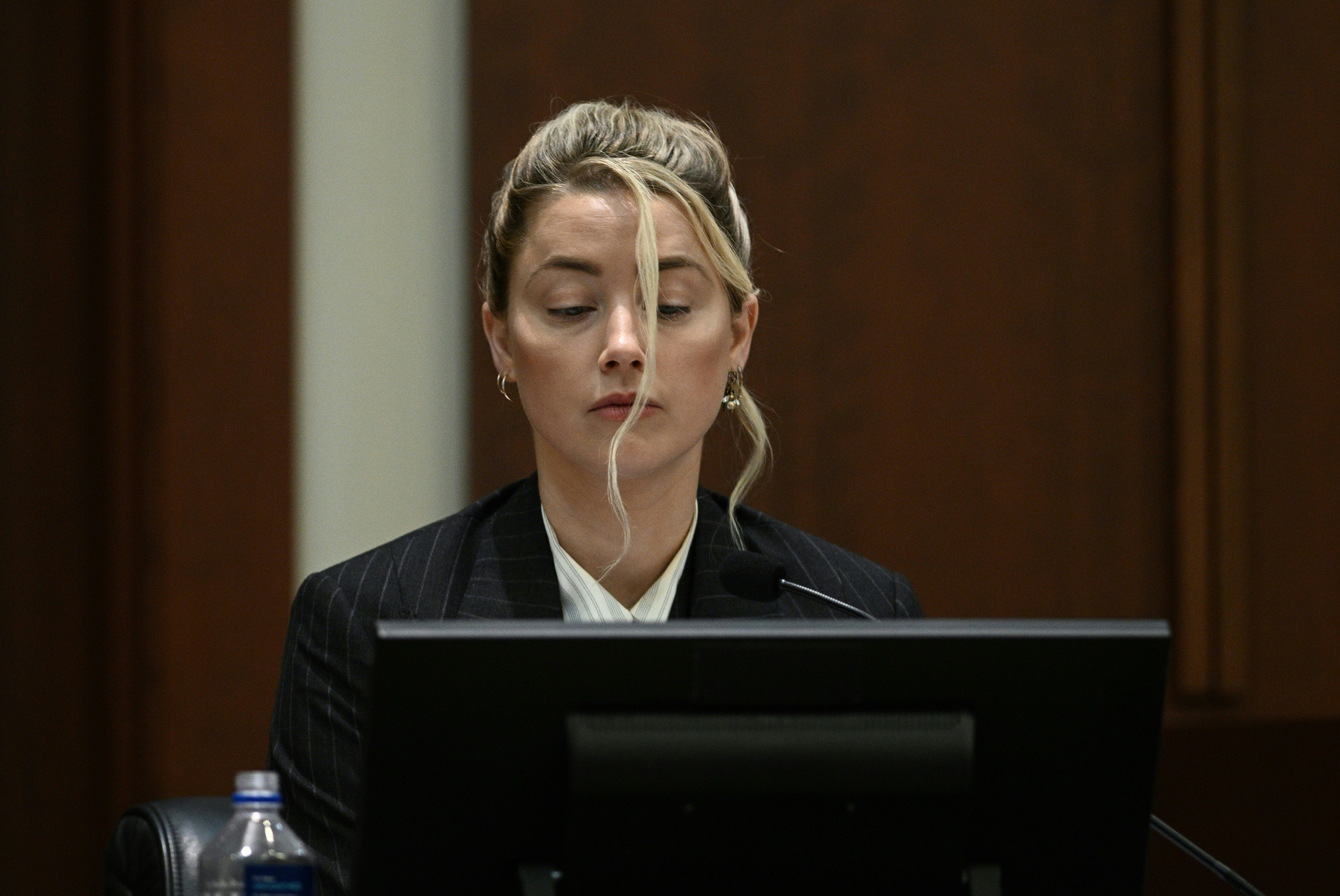 Amber Heard is seen on the witness stand during intense cross-examination in the trial