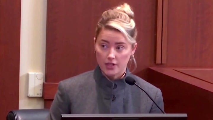 Amber Heard says Johnny Depp choked her against a wall on their honeymoon train trip