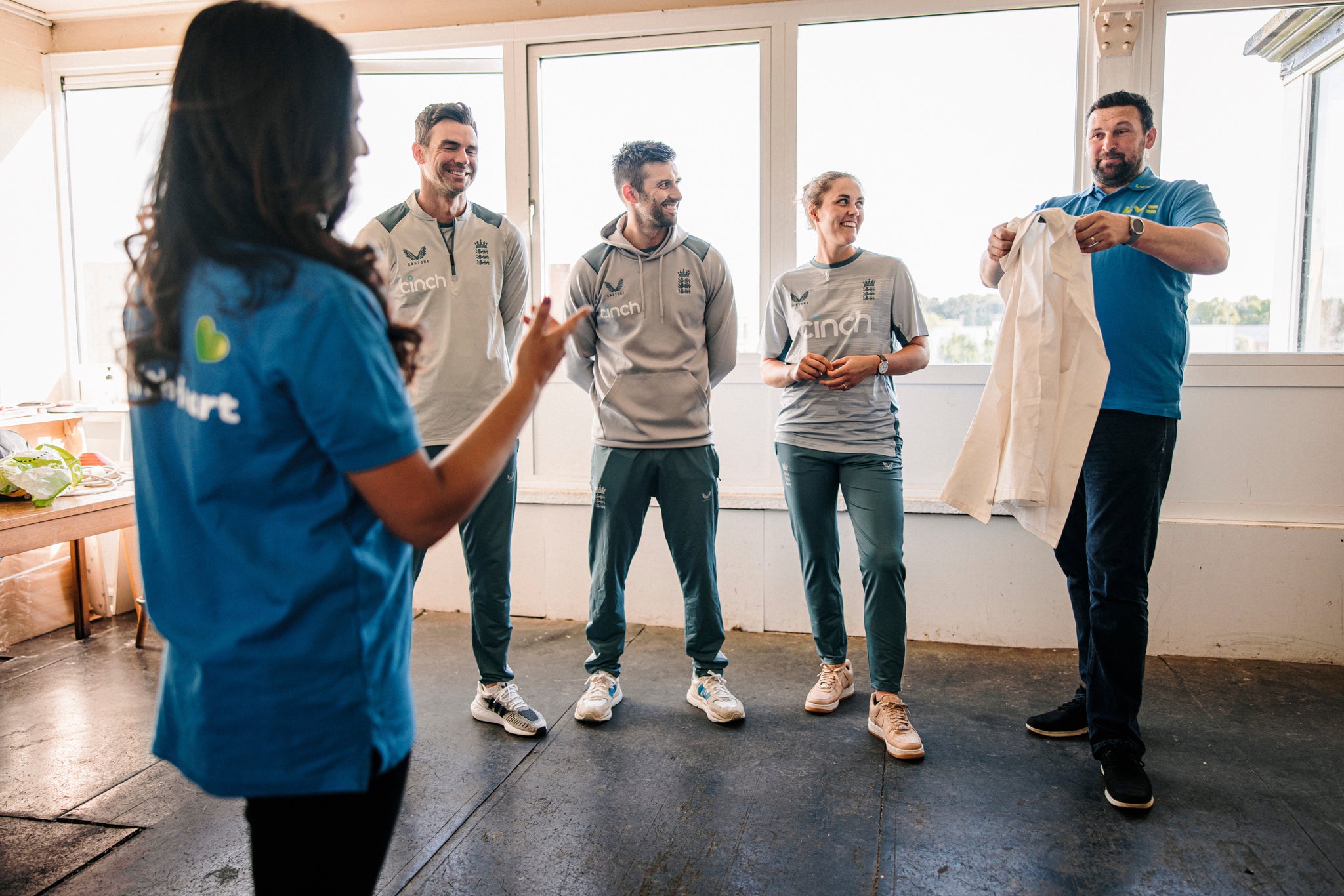 Anderson, second left, and other England cricketers surprised Leicester Electricity Sports Cricket Club during an inter-squad friendly game (LV= Insurance handout/PA)