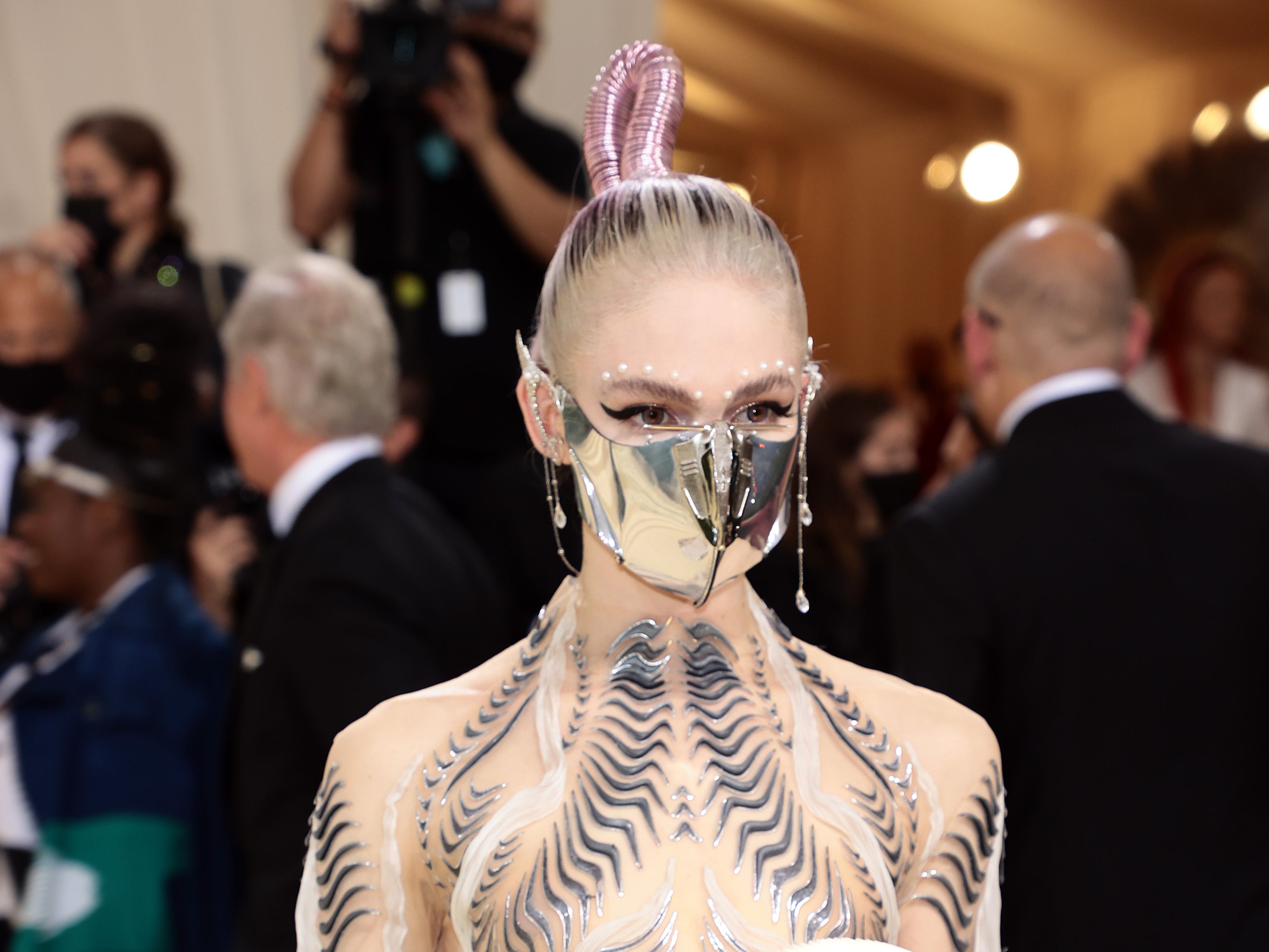 Grimes wore the metal face mask and elf ears at the Met Gala 2021