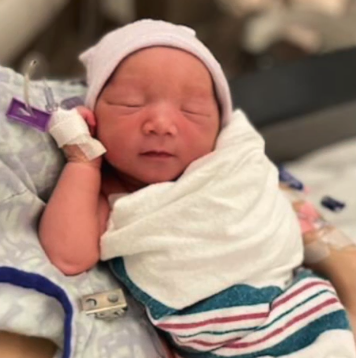 The baby born thousands of feet above the ground on a Frontier Airlines flight travelling between Denver and Orlando is seen after the mid-air labour