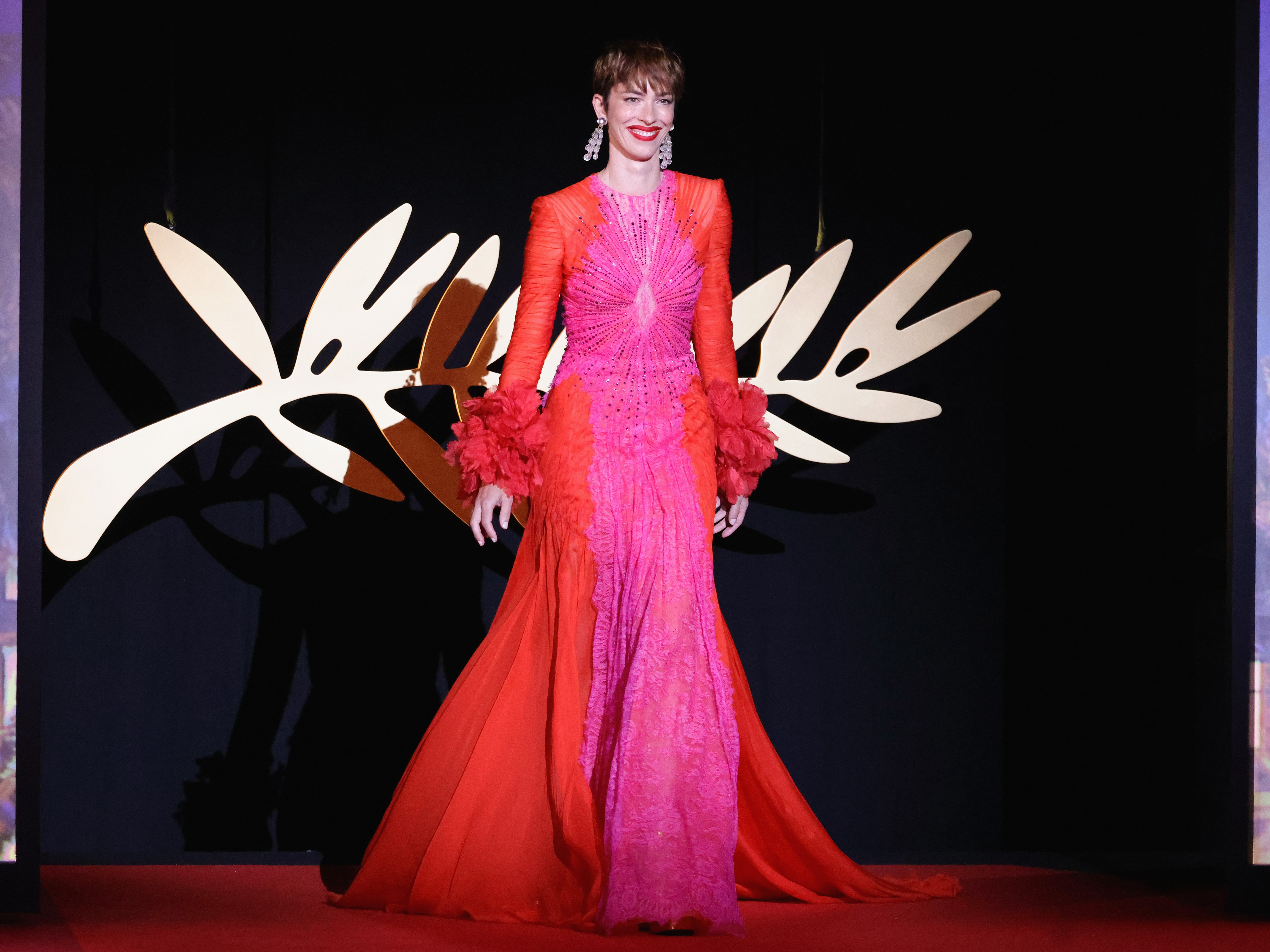 Jury member Rebecca Hall arrives on stage during the opening ceremony for the 75th annual Cannes film festival at Palais des Festivals