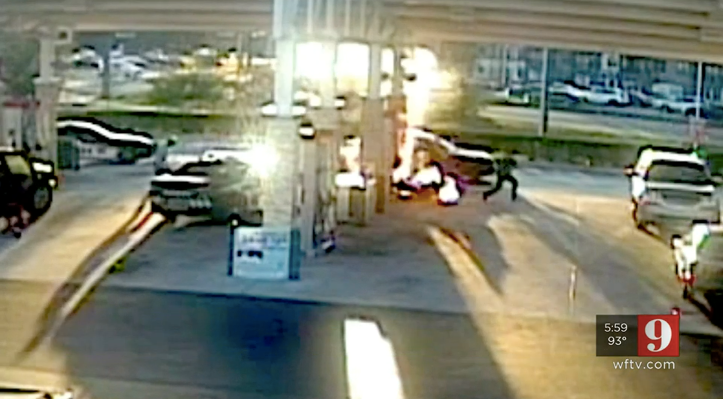 The surveillance video footage from an Orange County gas station shows the moment an explosive fire broke out after a motorcyclist was tasered by a sheriff deputy.