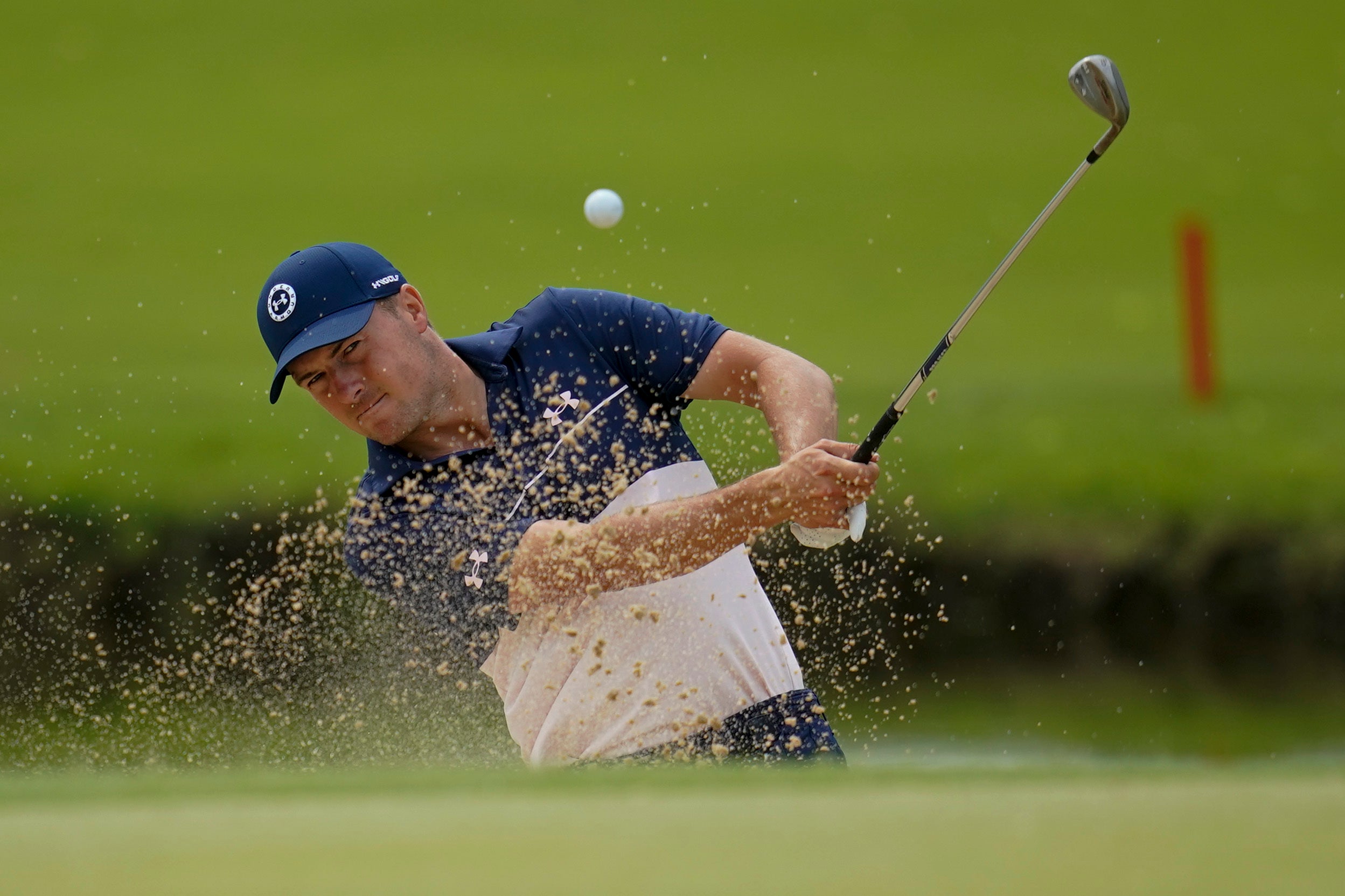 Jordan Spieth plays from a bunker on the 13th hole during a practice round for the US PGA Championship (Sue Ogrocki/AP)