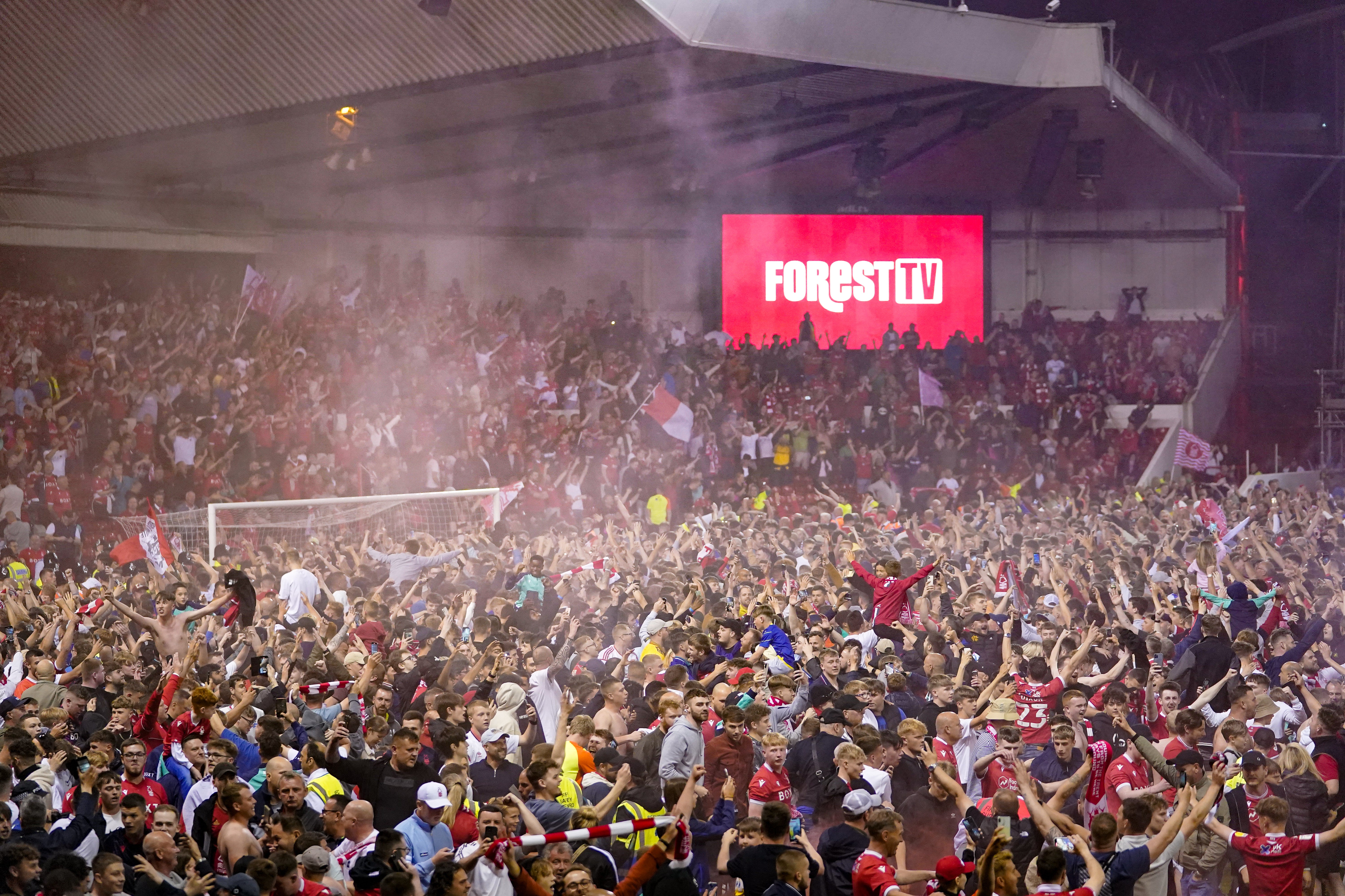 Nottingham Forest fans spilled on to the pitch in celebration of their play-off semi-final win (Zac Goodwin/PA)