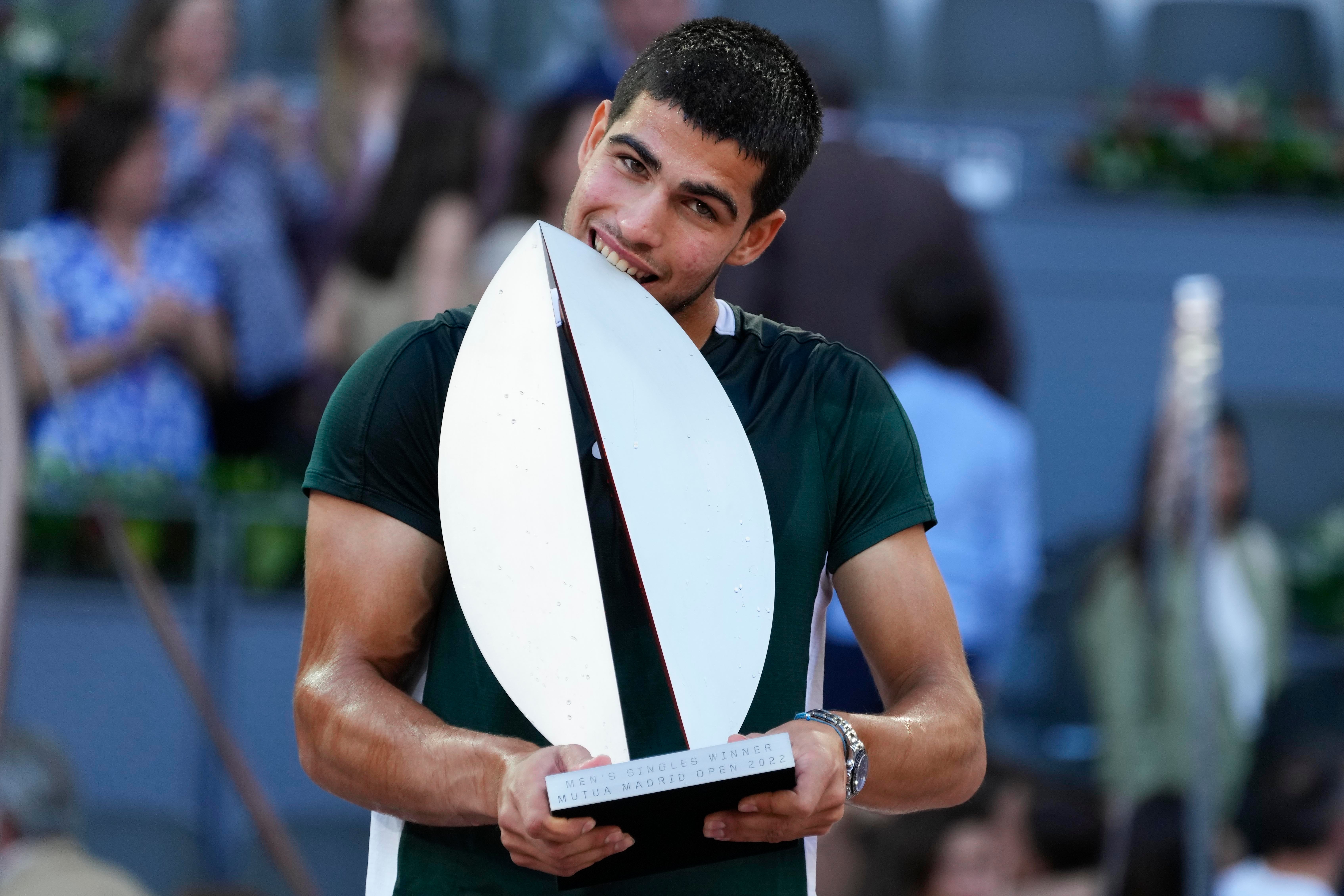 Carlos Alcaraz with the Madrid Open trophy (Paul White/AP)