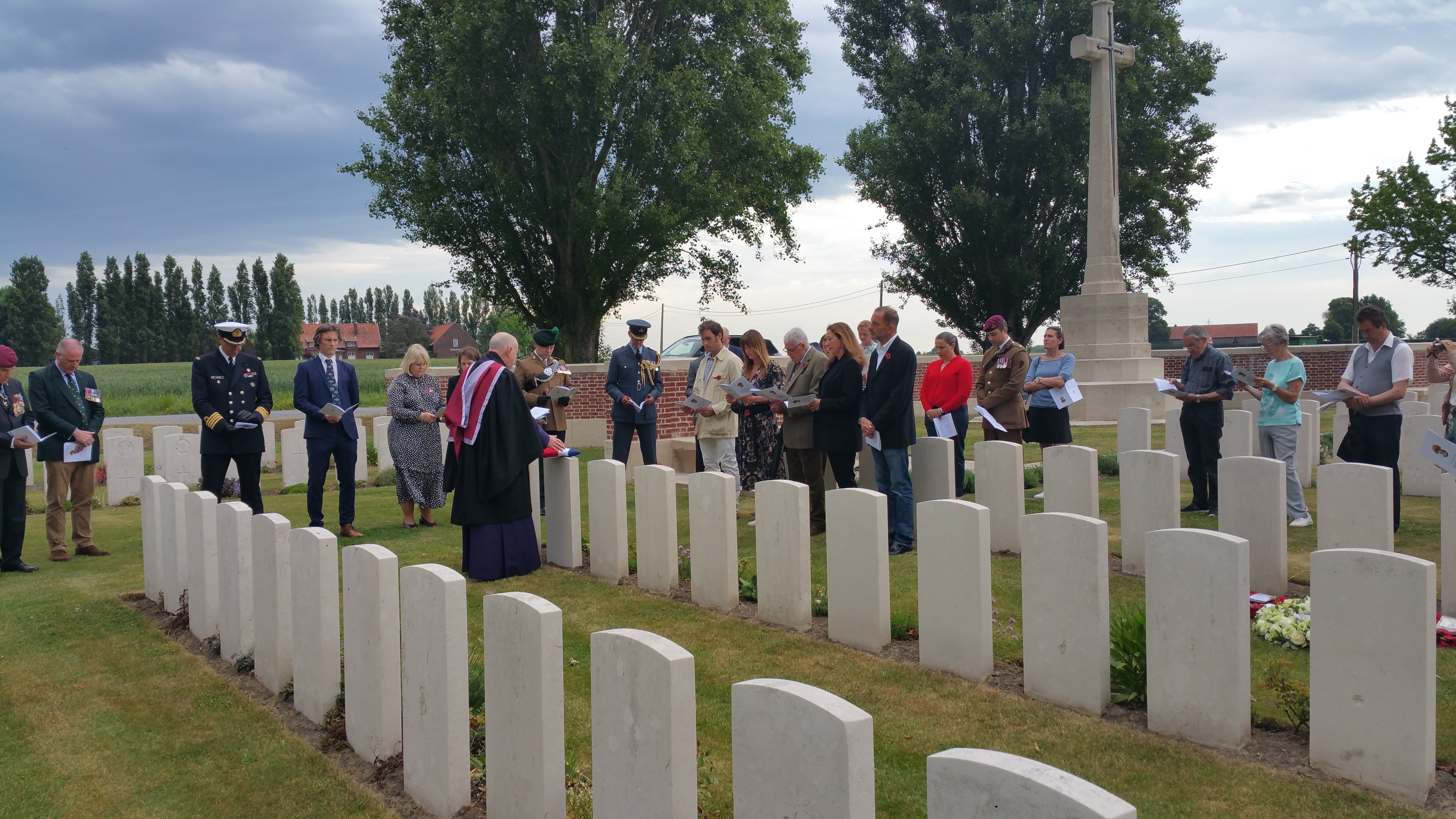 Photo caption 3 Gp Capt John Dickson, Defence Attaché to Belgium and Luxembourg, lays a wreath at the grave of Sjt Cardy (MOD/PA)