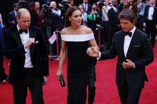 Kate Middleton helped up red carpet steps by Tom Cruise as she and Prince William attend Top Gun premiere