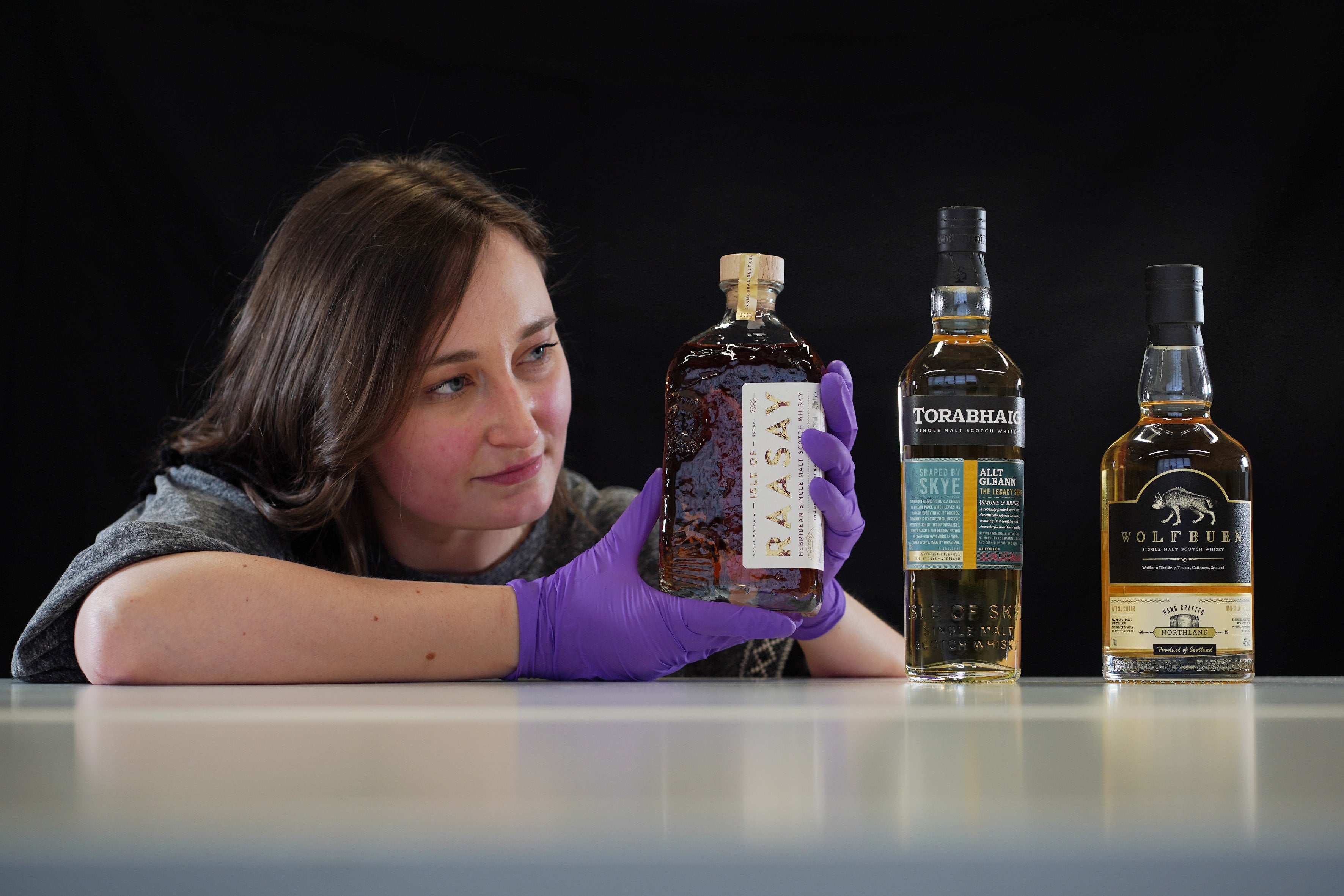 Several bottles of whisky are among the collection (National Museums Scotland/PA)