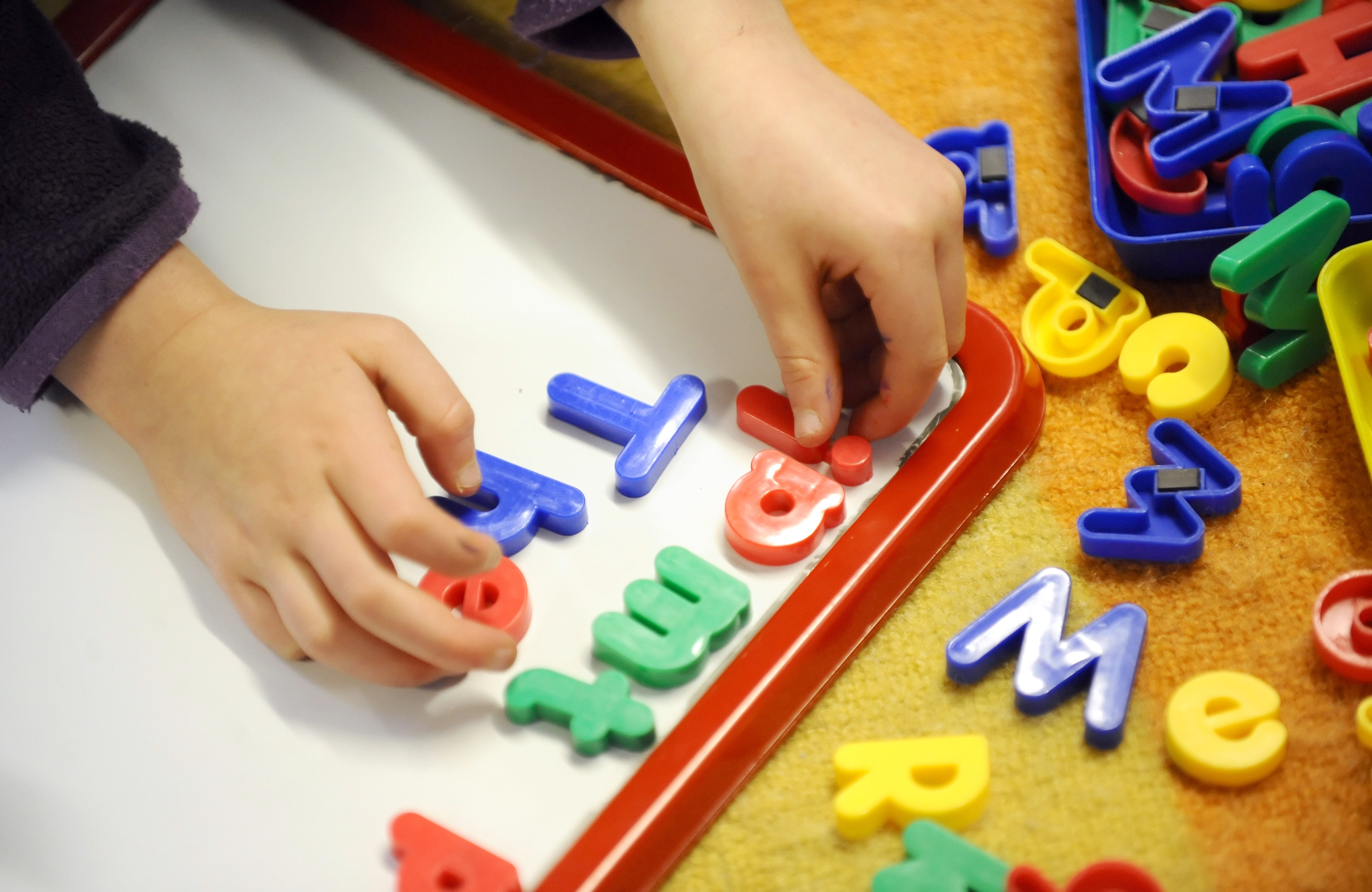 A primary school child at work in a classroom (PA)