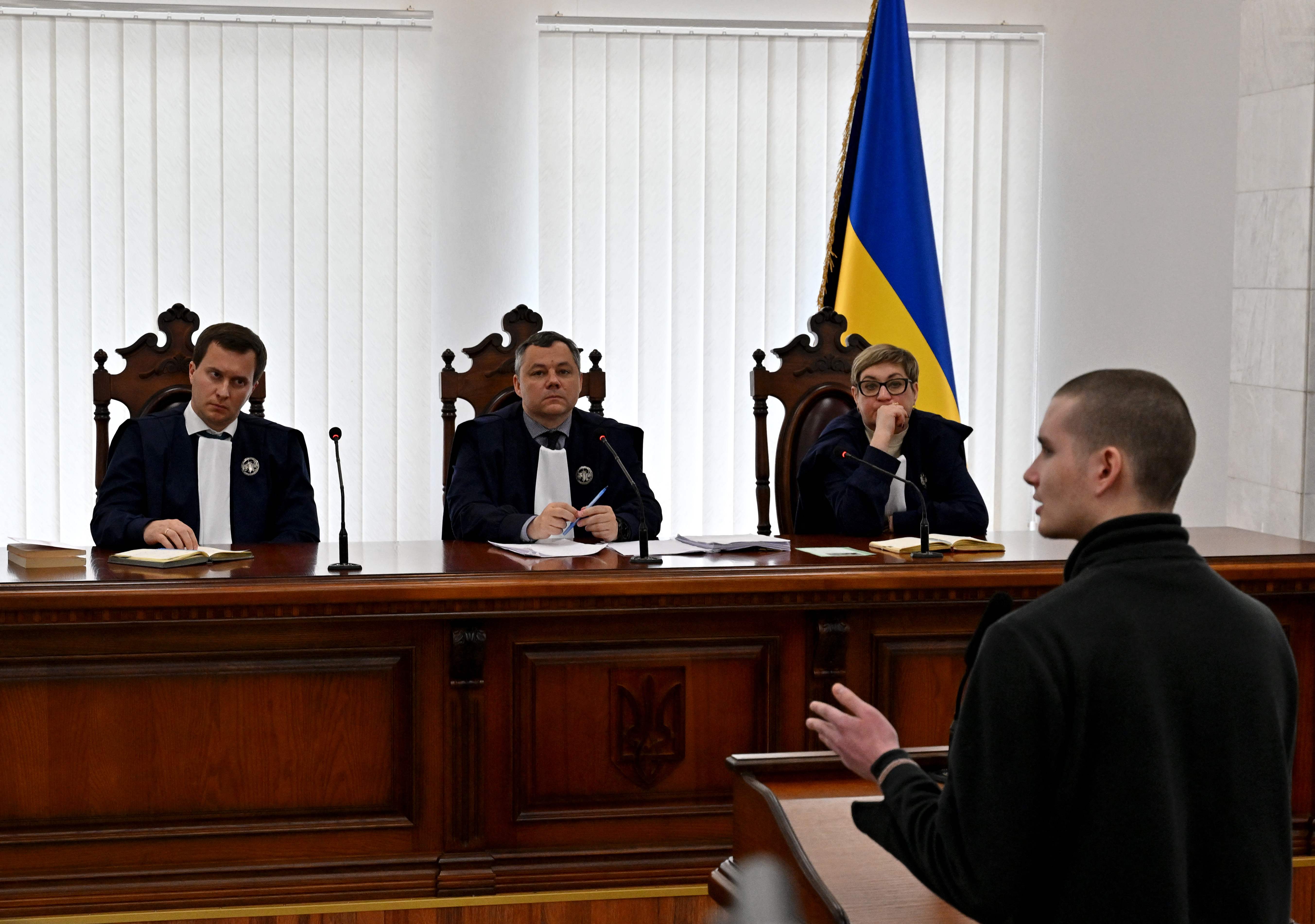 Captive Russian soldier Ivan Matysov (right) testifies in the trial of fellow soldier Vadim Shishimarin