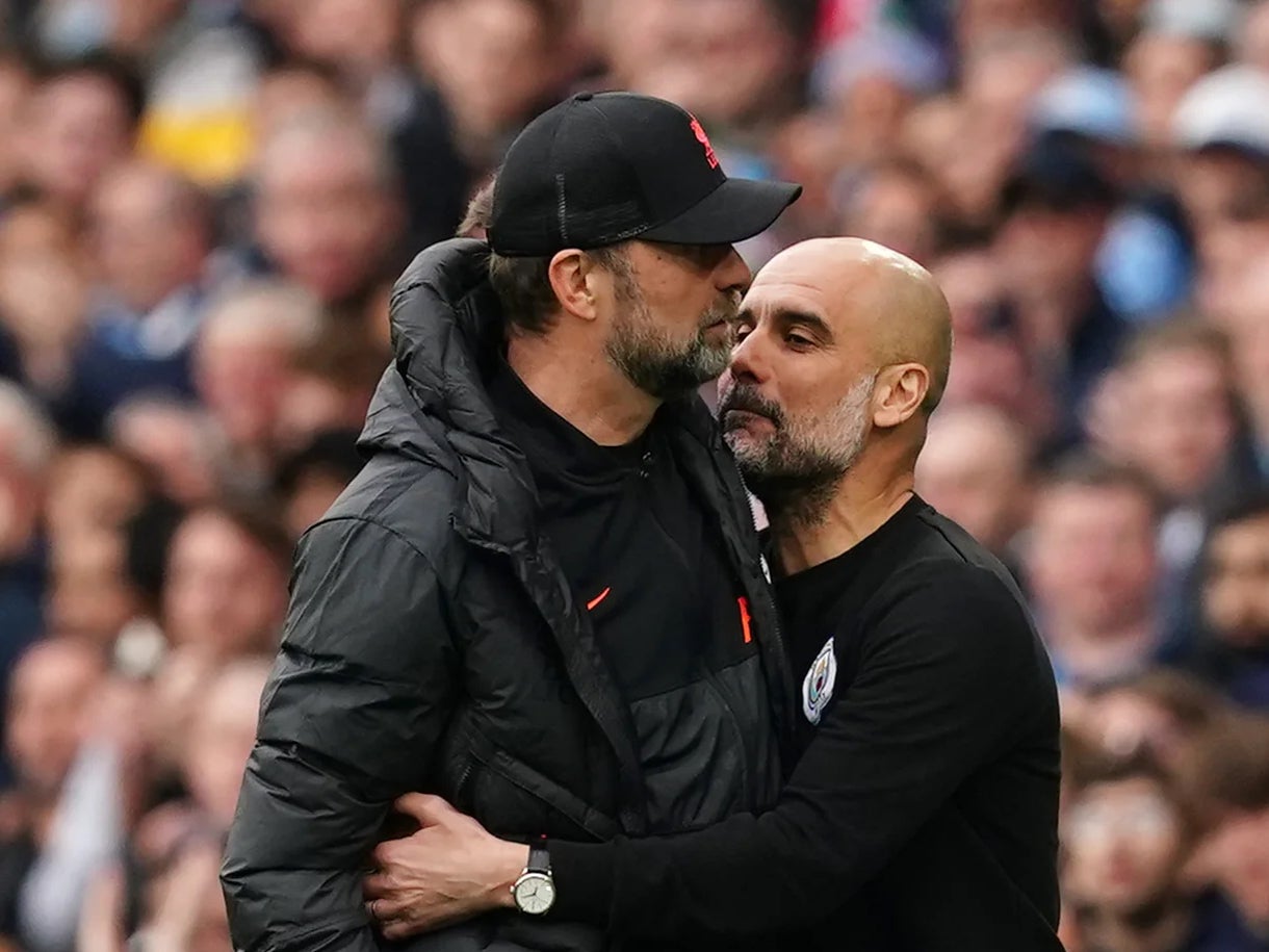 Liverpool boss Jurgen Klopp, left, will attempt to snatch the Premier League title from Pep Guardiola’s Manchester City (Martin Rickett/PA)