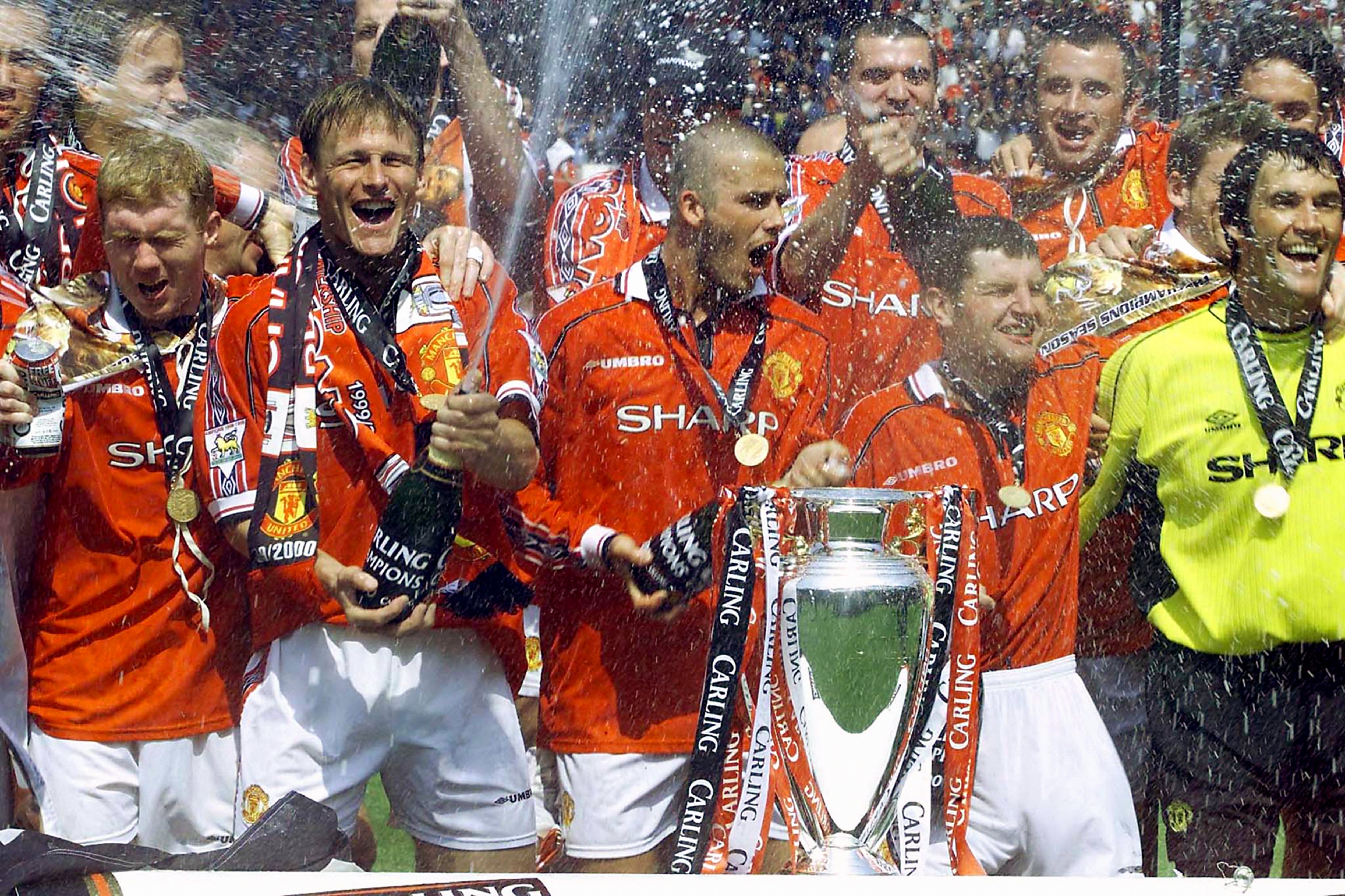 Manchester United celebrate after clinching the 1998-99 Premier League title with victory over Tottenham (Owen Humphreys/PA)