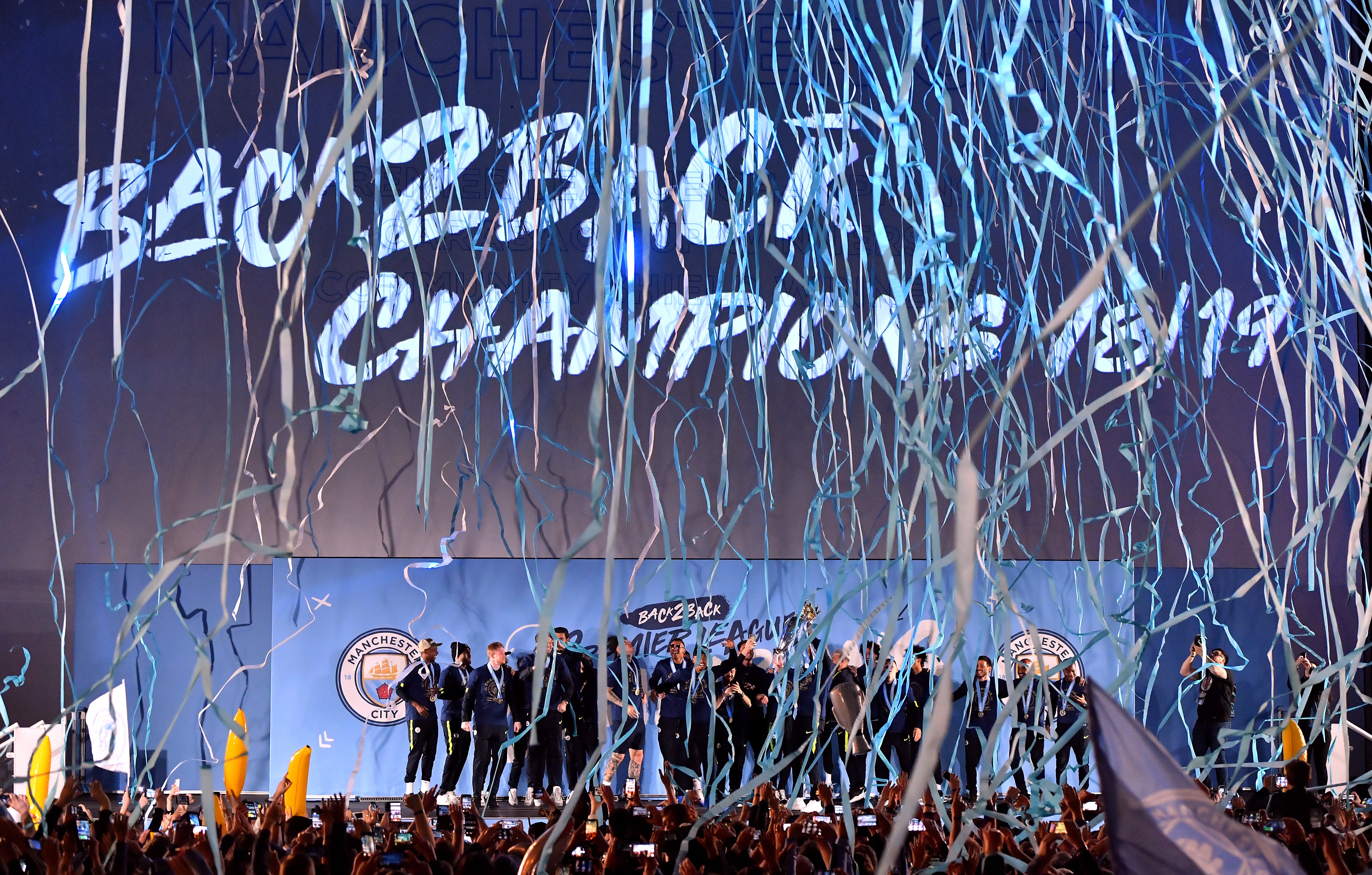 Manchester City’s players and staff celebrate Premier League glory after victory over Brighton (Anthony Devlin/PA)