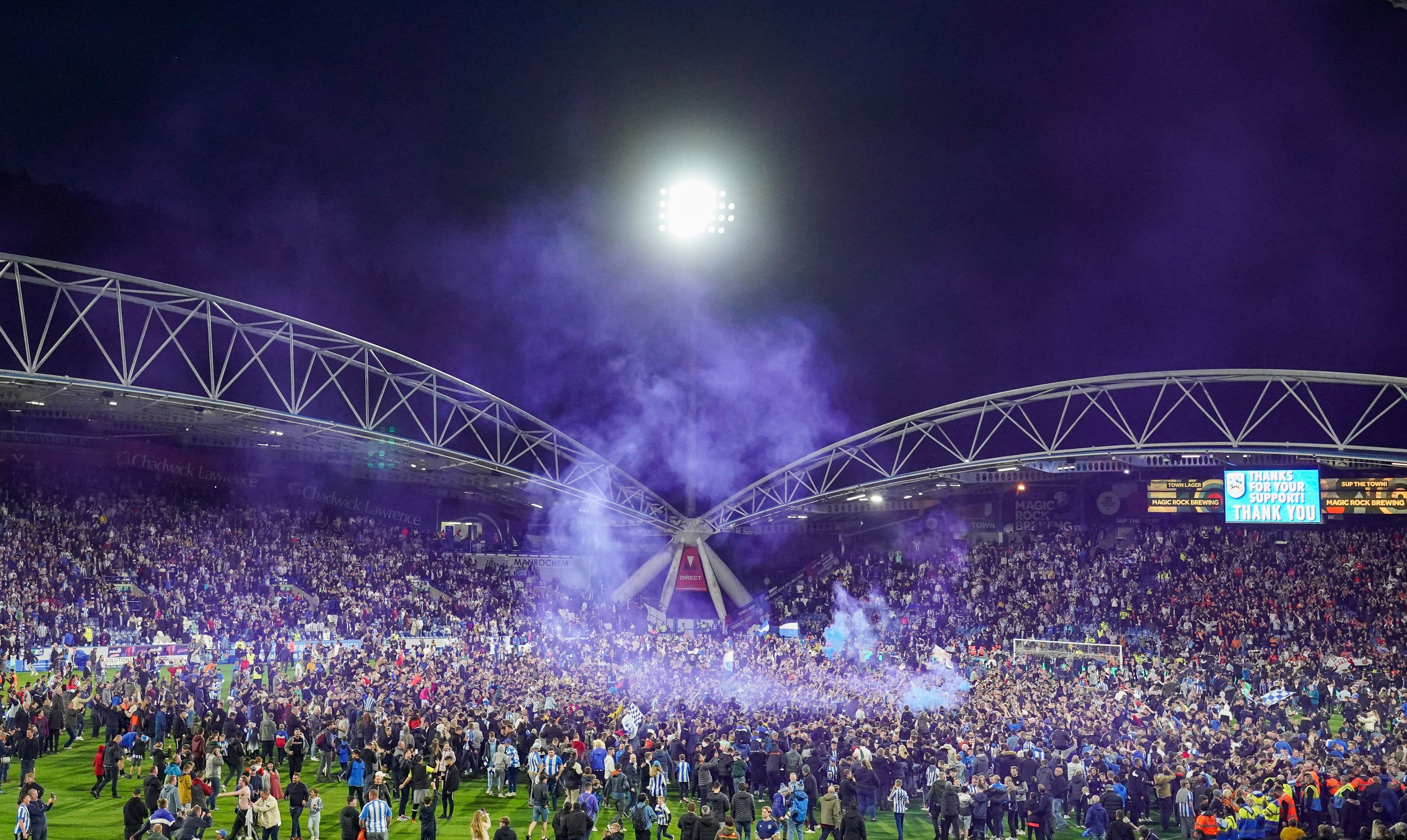 Pitch invasions have been a common sight at matches in England over the last week (Tim Goode/PA)