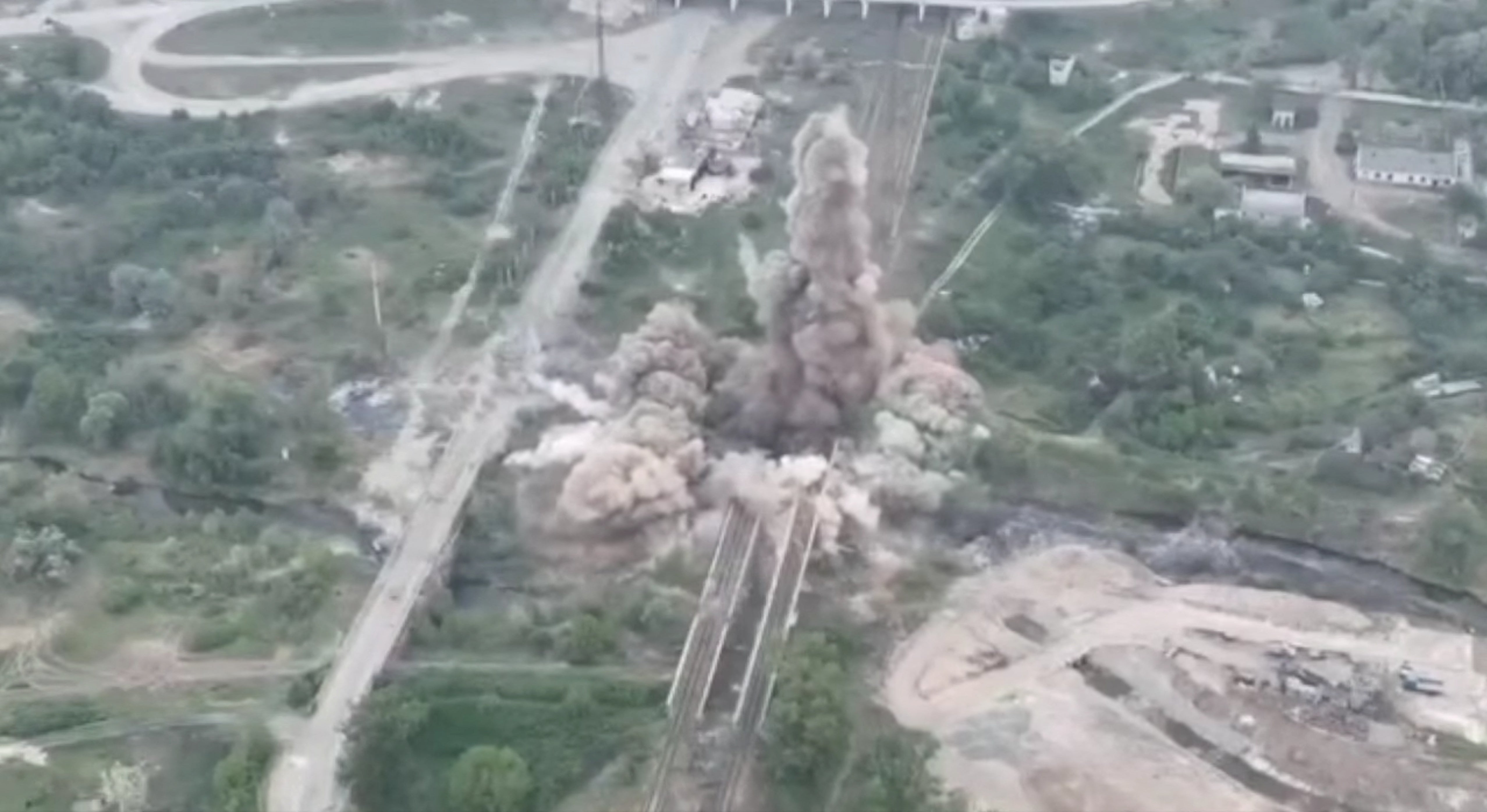 An image of an explosion blowing up a bridge connecting Severodonetsk and Lysychansk