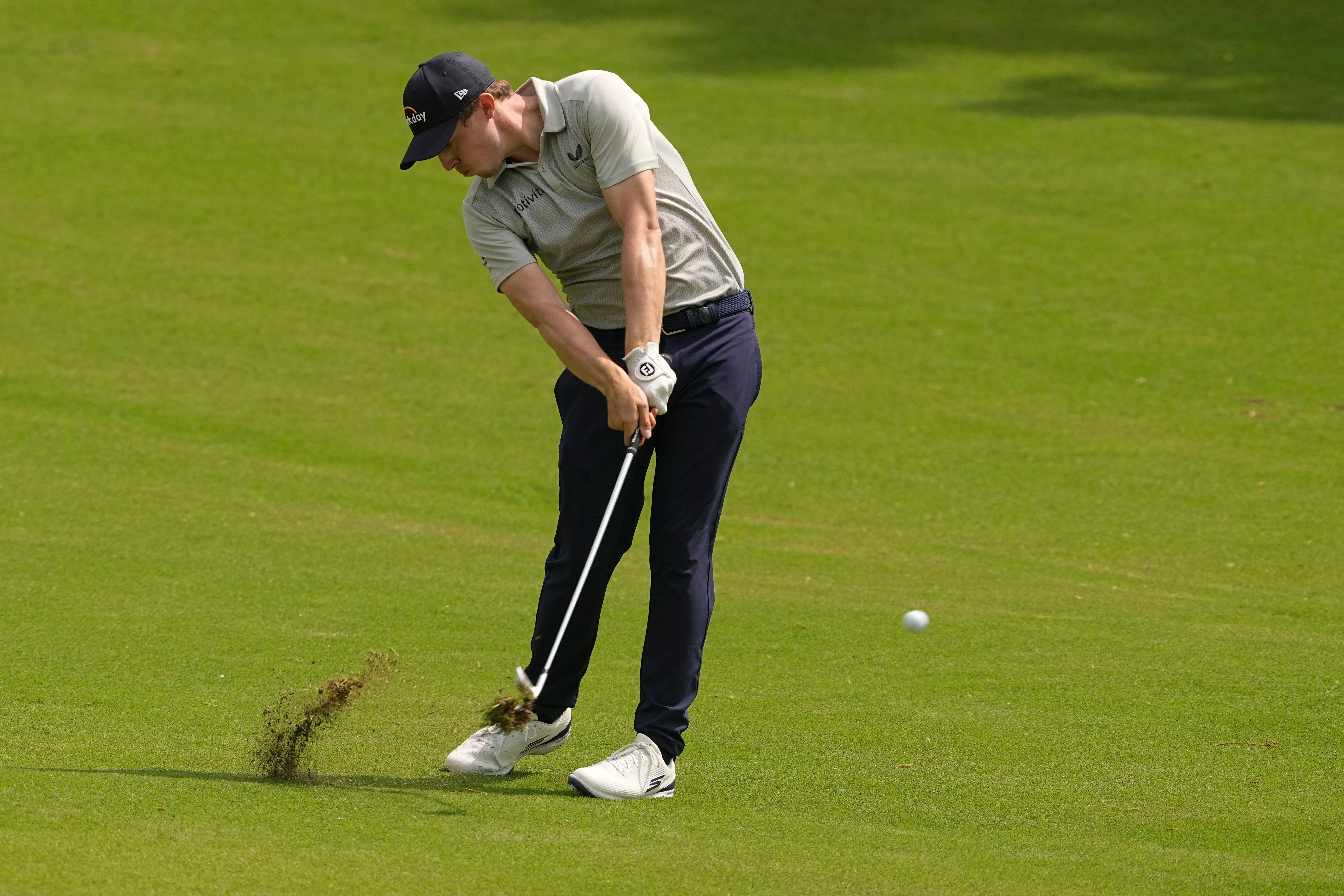 Matt Fitzpatrick hits from the fairway on the 18th hole during the second round of the US PGA Championship (Matt York/AP)