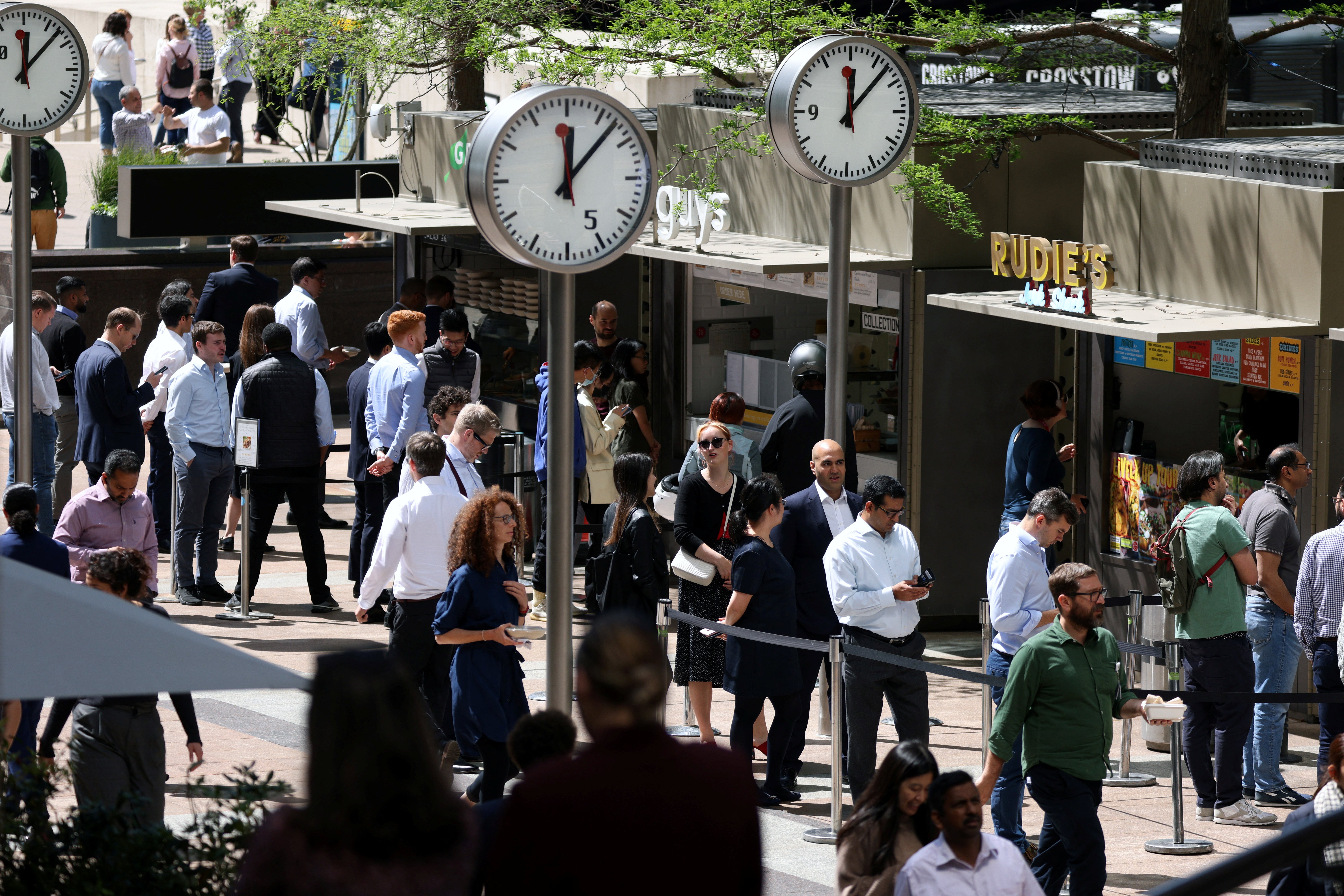 Workers queue for food in the financial district, Canary Wharf, London