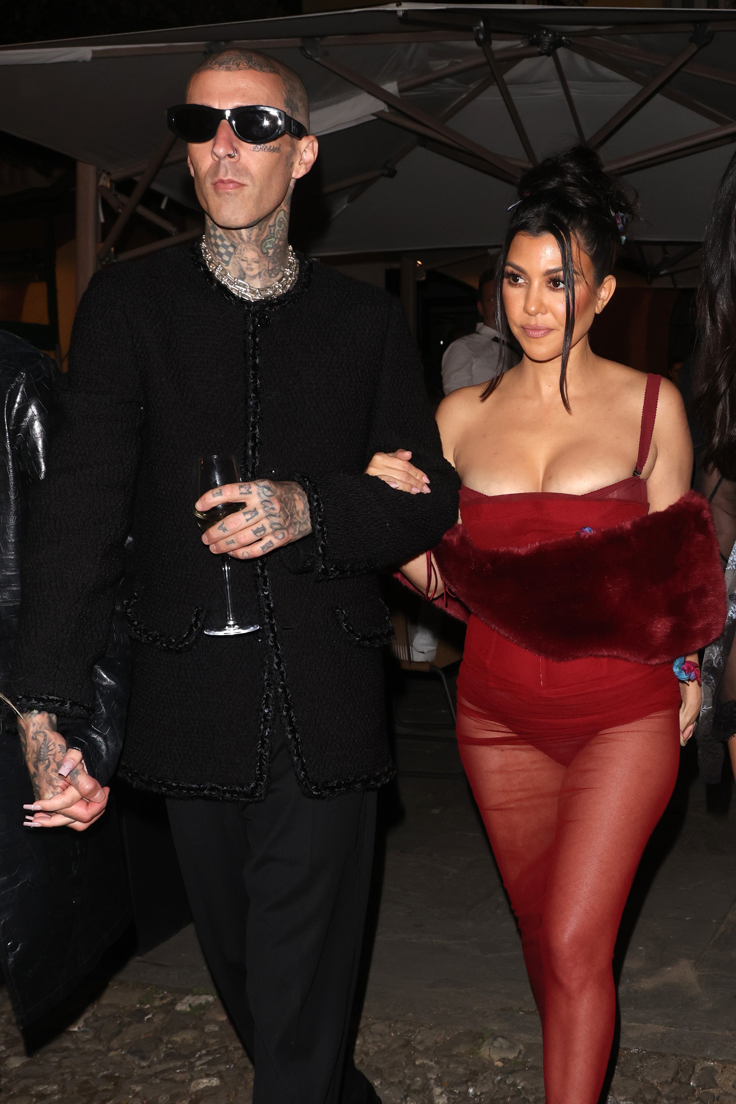 Kourtney Kardashian wore a red sheer dress