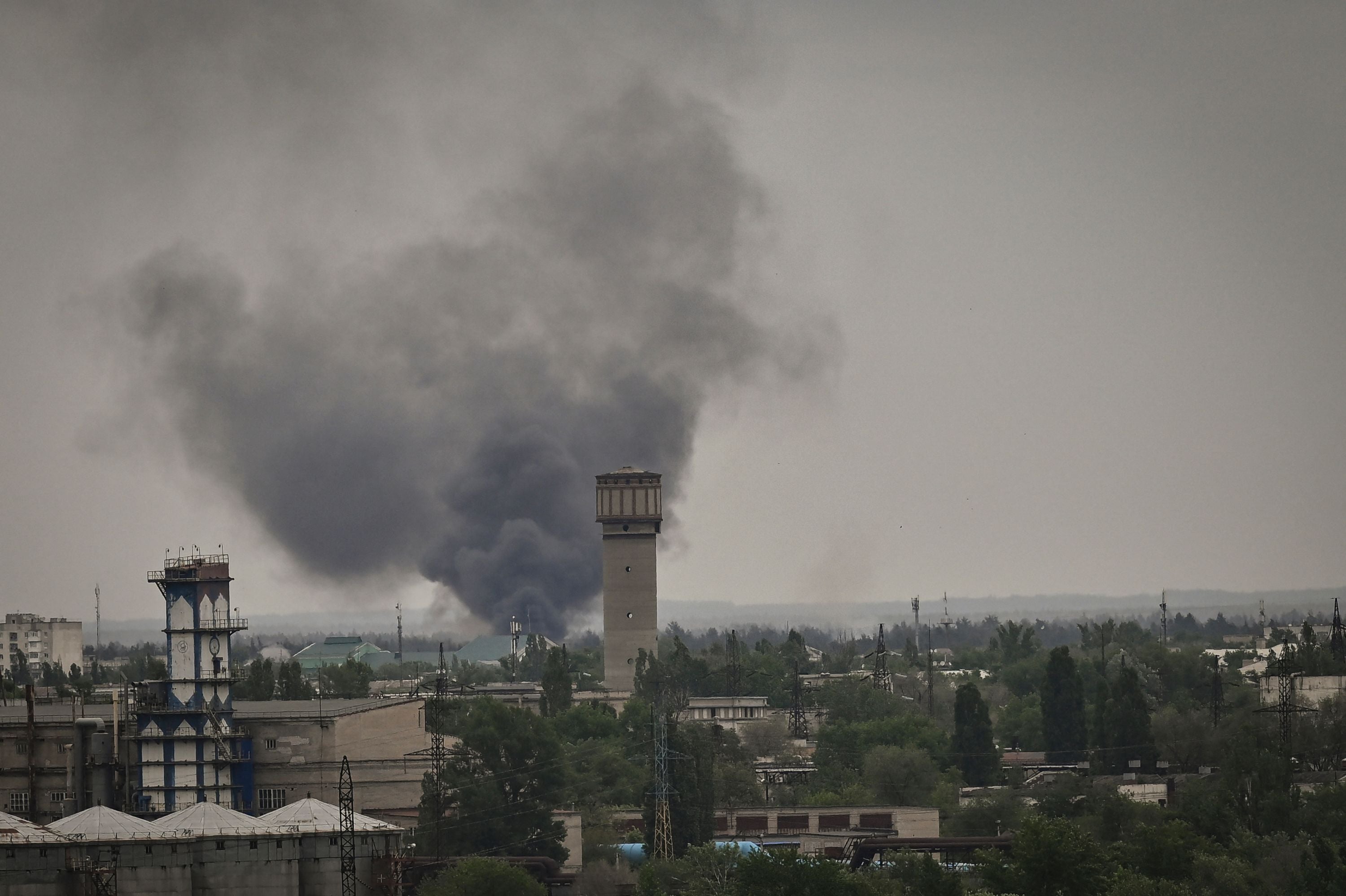 Smoke rises during shelling in the city of Severodonetsk on 21 May 2022