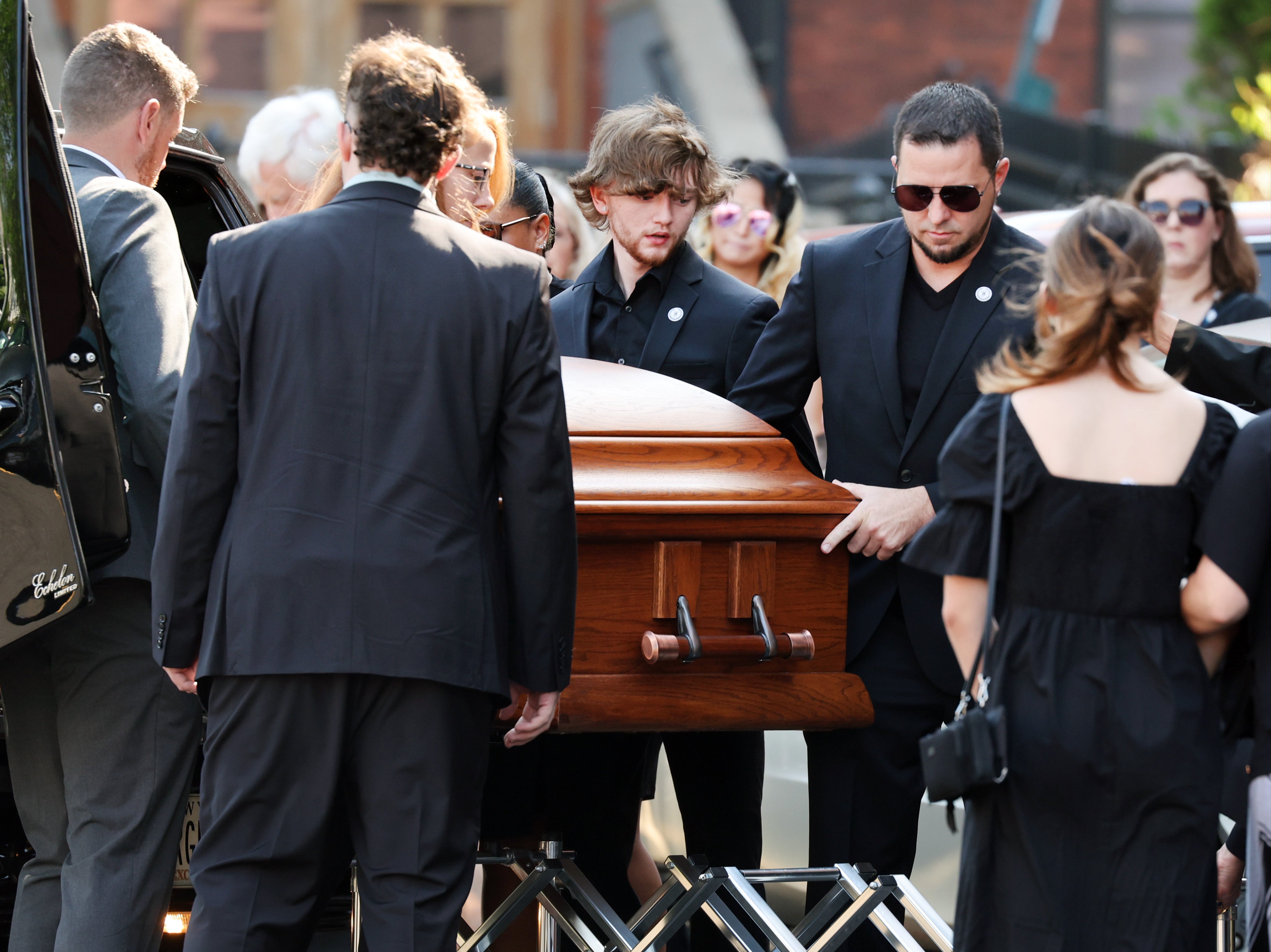 The casket of Roberta Drury being brought into the church at her funeral