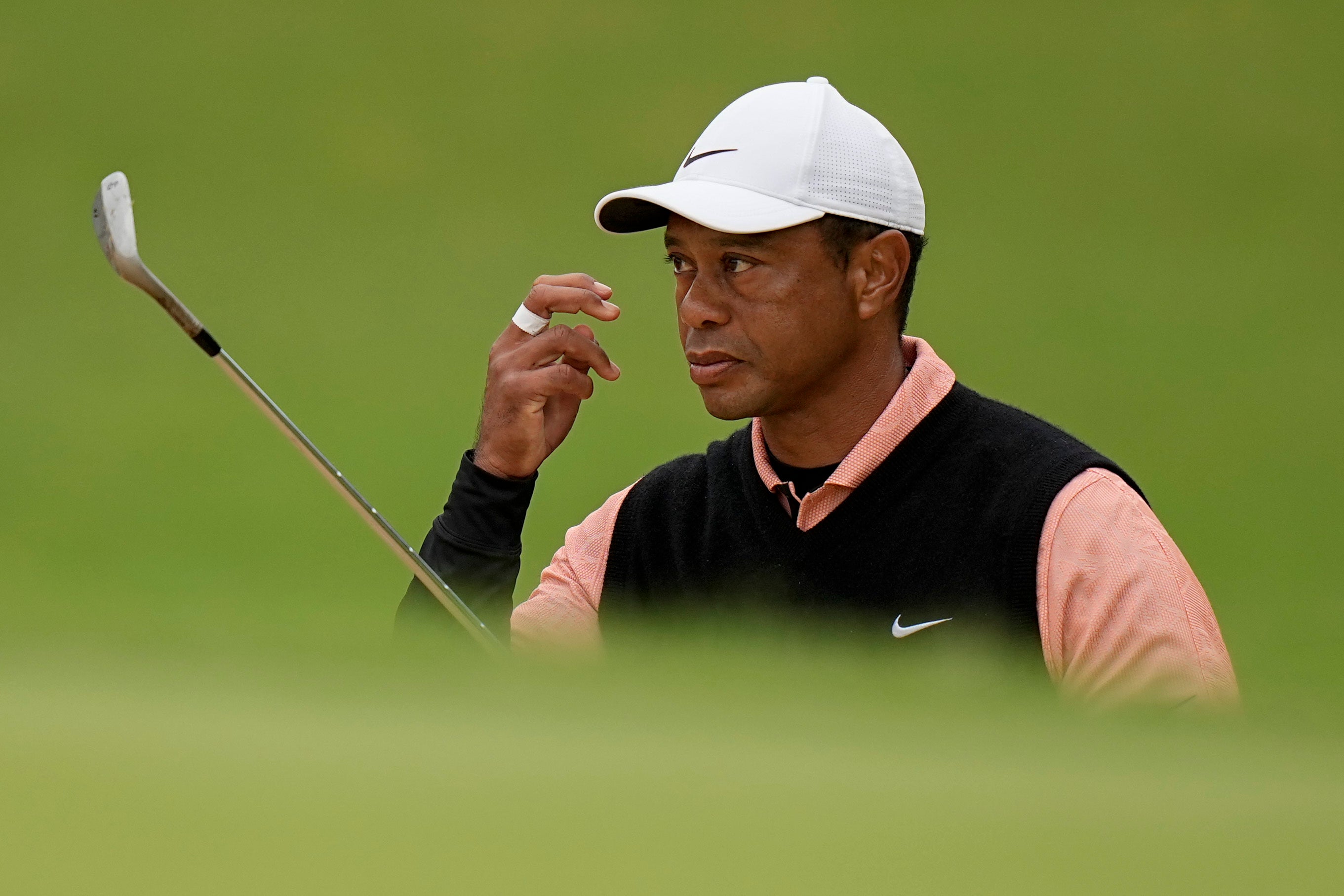 Tiger Woods watches his shot to the green on the 17th hole during the third round of the US PGA Championship (Eric Gay/AP)