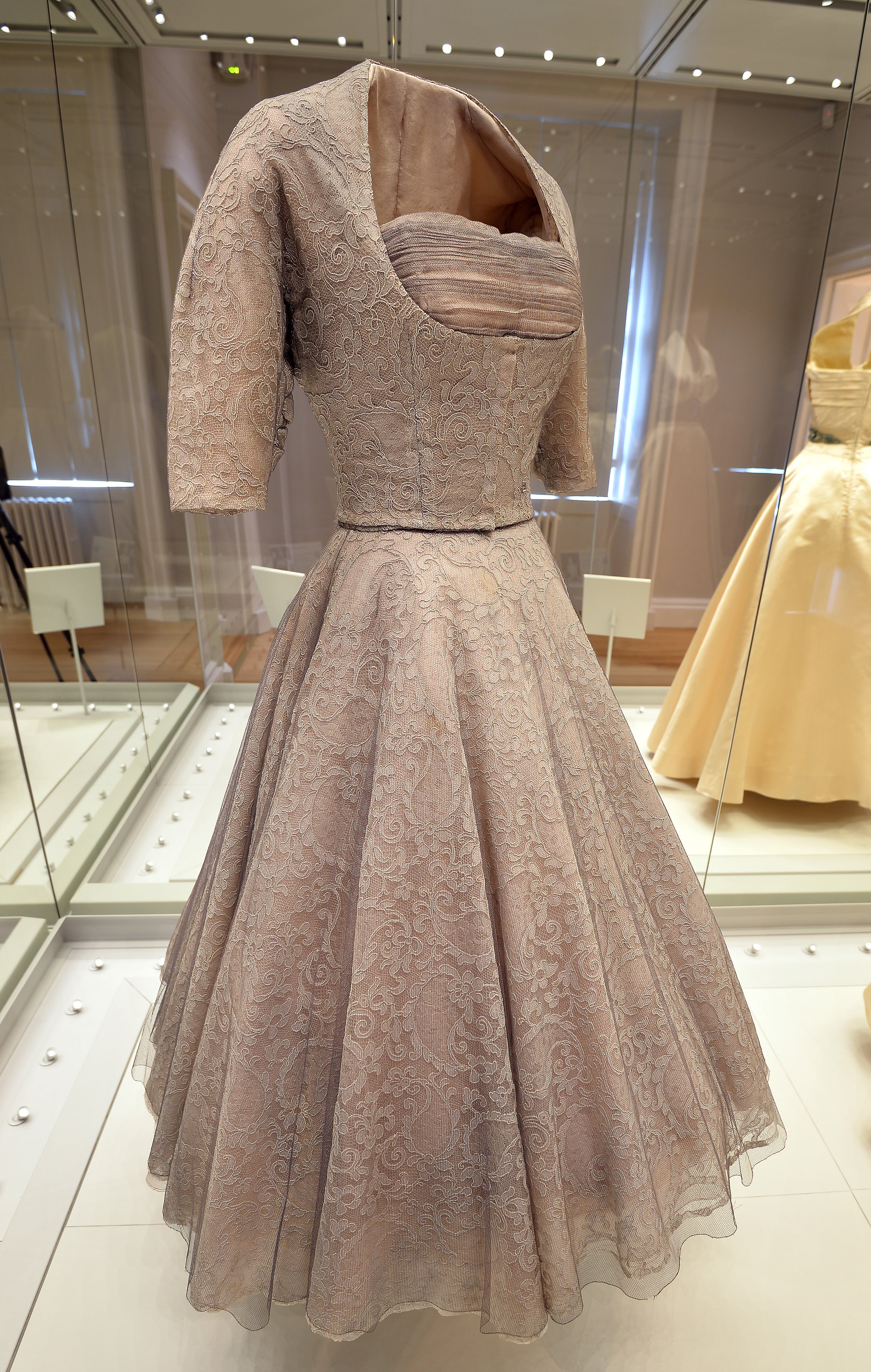 A grey lace dress worn by Princess Margaret in 1952, the same year that Aviva looked at in its archives to mark the Platinum Jubilee (John Stillwell/PA Archive)