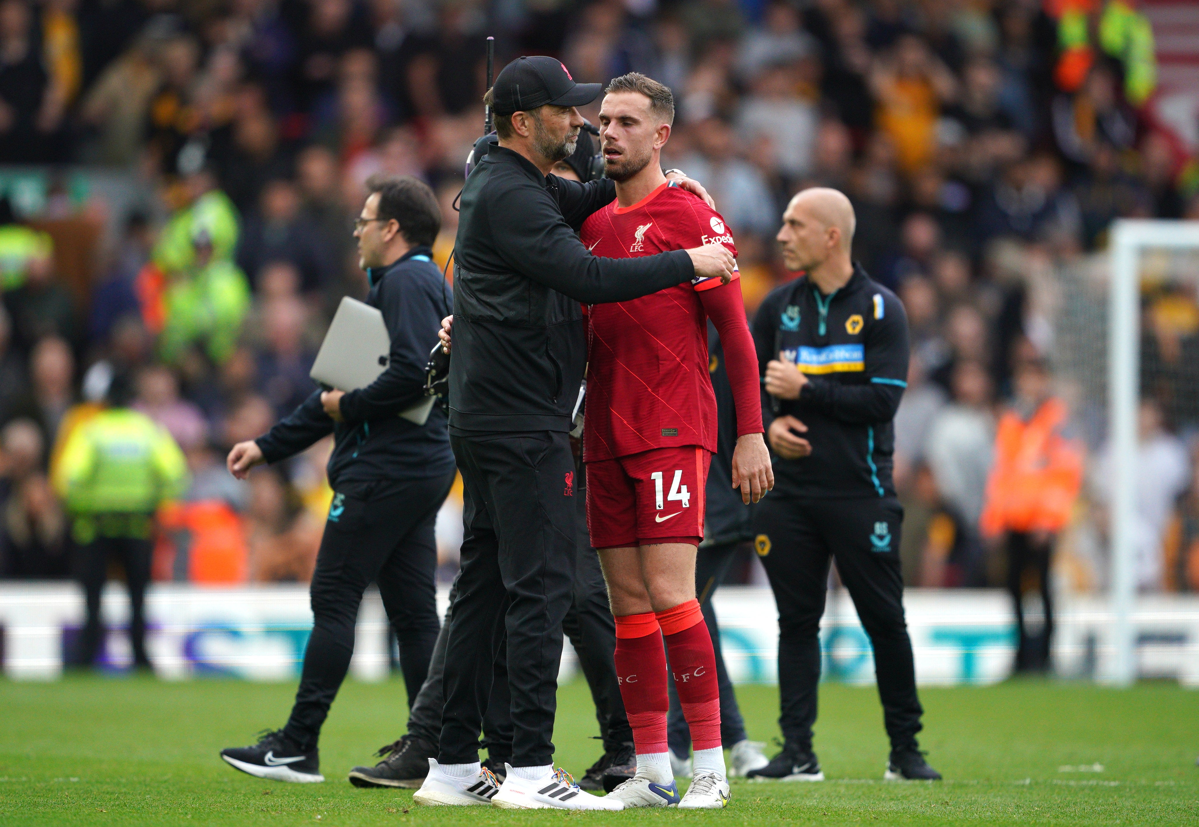 Liverpool manager Jurgen Klopp embraces captain Jordan Henderson after the final whistle (Peter Byrne/PA)